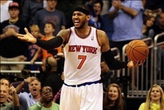 Feb 21, 2014; Orlando, FL, USA; New York Knicks small forward Carmelo Anthony (7) reacts after stepping out of bounds with less then a minute to go in regulation with the game tied as the Orlando Magic beat the New York Knicks 129-121 in double overtime a