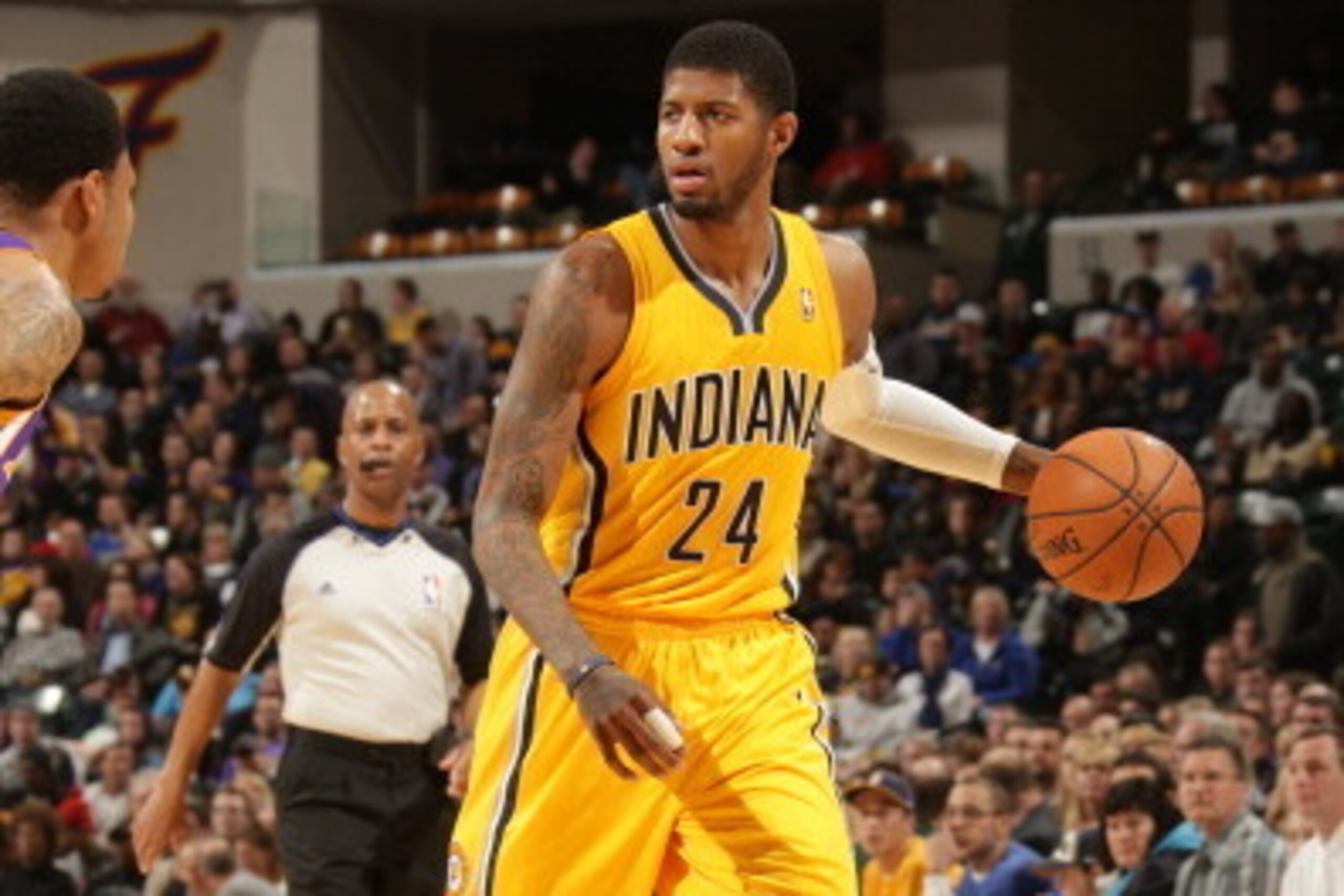 INDIANAPOLIS - FEBRUARY 25: Paul George #24 of the Indiana Pacers handles the ball against the Los Angeles Lakers at Bankers Life Fieldhouse on February 25, 2014 in Indianapolis, Indiana.  NOTE TO USER: User expressly acknowledges and agrees that, by down