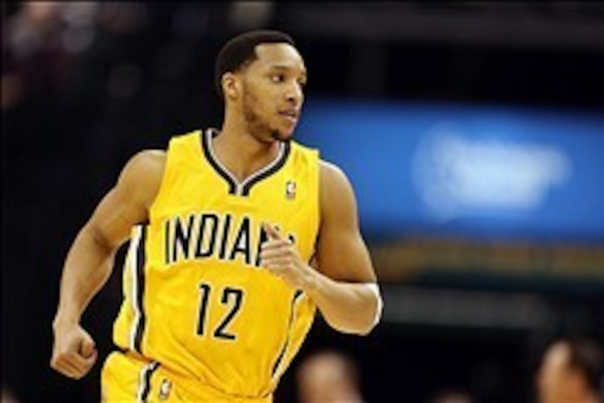 Feb 25, 2014; Indianapolis, IN, USA; Indiana Pacers guard Evan Turner (12) runs up the floor during a game against the Los Angeles Lakers at Bankers Life Fieldhouse. Mandatory Credit: Brian Spurlock-USA TODAY Sports