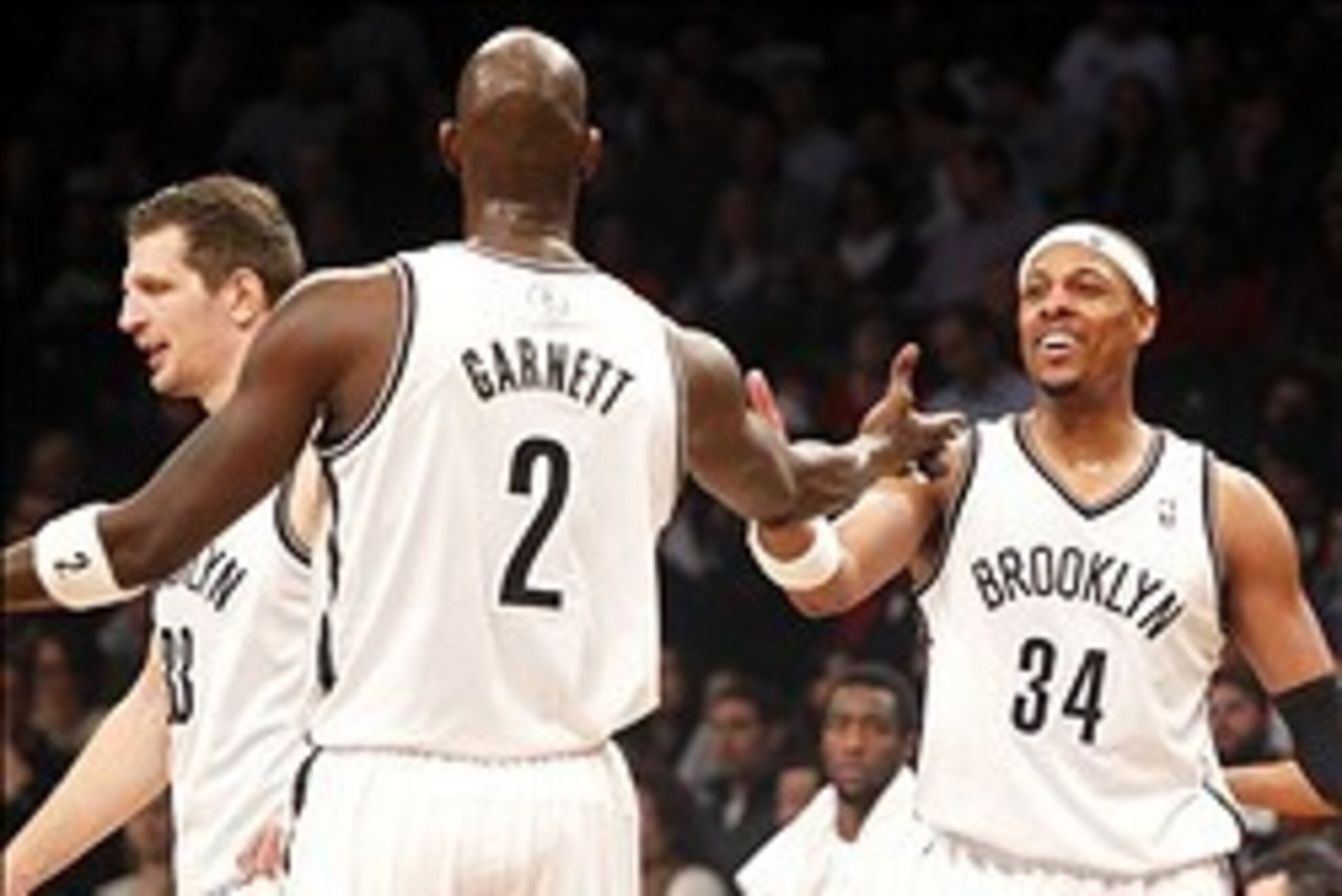 Feb 3, 2014; Brooklyn, NY, USA; Brooklyn Nets forward Kevin Garnett (2) reacts with Brooklyn Nets forward Paul Pierce (34) in the fourth quarter against Philadelphia 76ers at Barclays Center. Nets won 108-102. Mandatory Credit: Nicole Sweet-USA TODAY Spor