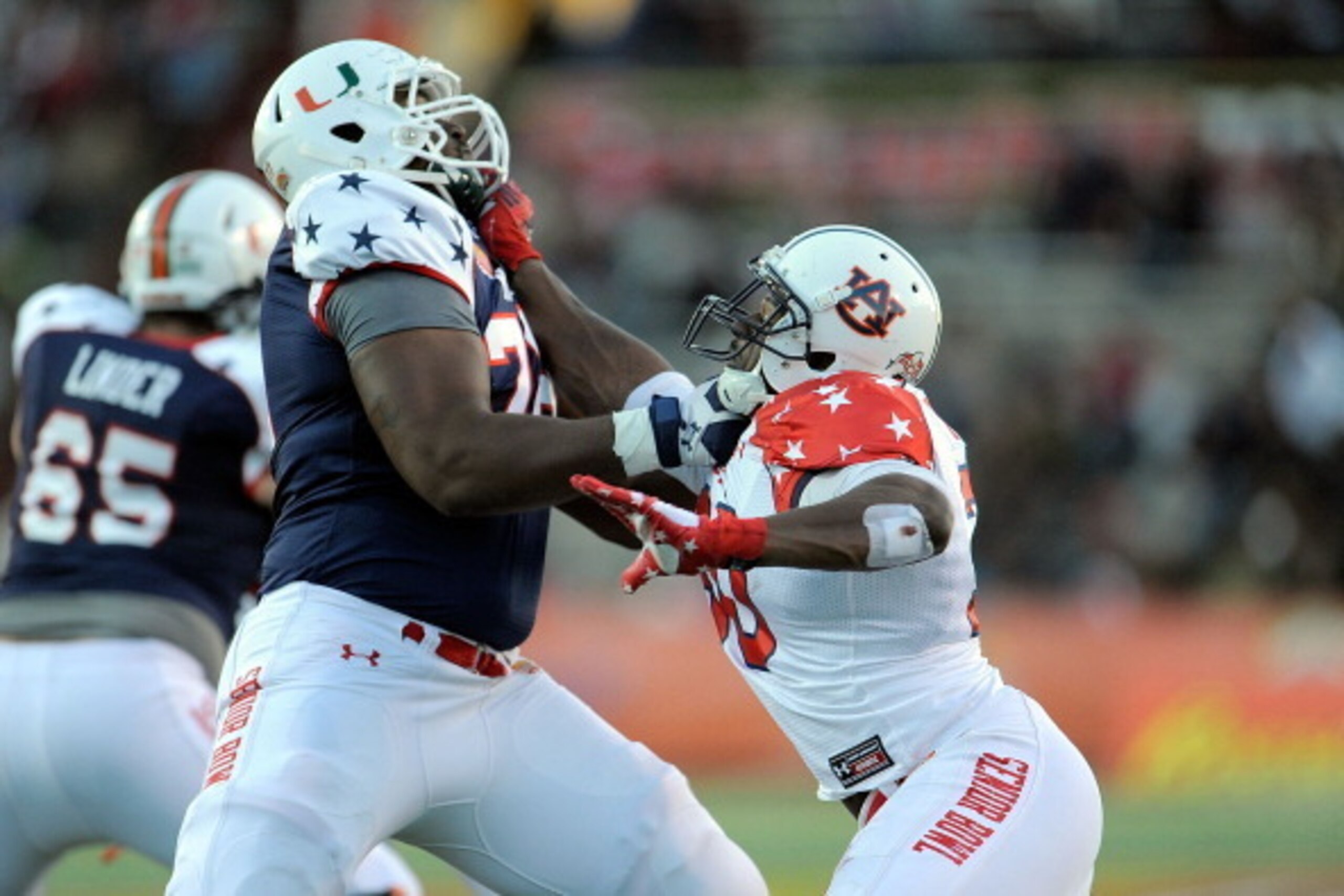 MOBILE, AL - JANUARY 25:  Dee Ford #30 of the South squad works against Seantrel Henderson #76 of the North squad during the Reese's Senior Bowl at Ladd-Peebles Stadium on January 25, 2014 in Mobile, Alabama.  The South defeated the North 20-10.  (Photo b