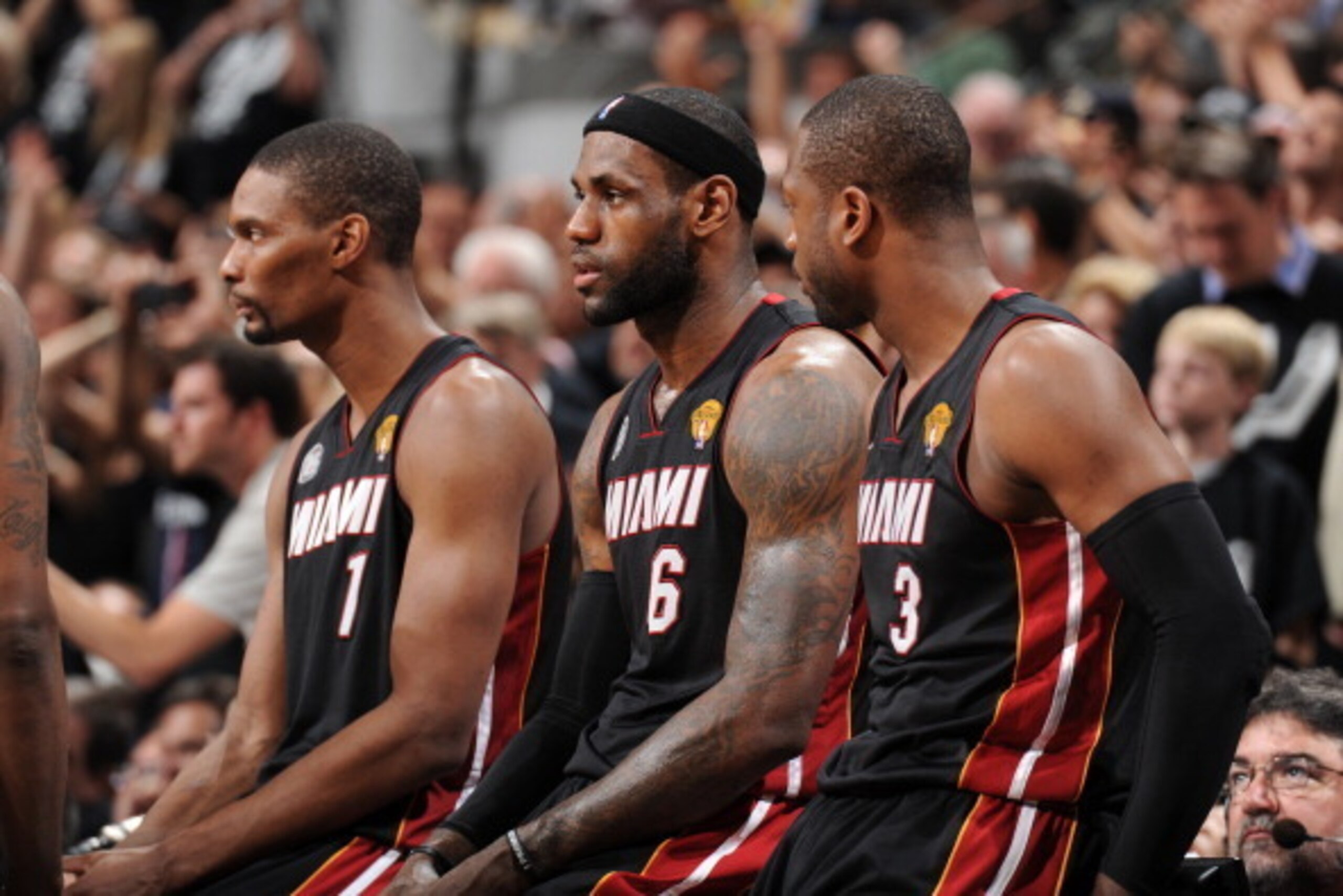 SAN ANTONIO, TX - JUNE 16: Chris Bosh #1, LeBron James #6 and Dwyane Wade #3 of the Miami Heat sit at the scorers' table during Game Five of the 2013 NBA Finals against the San Antonio Spurs on June 16, 2013 at the AT&T Center in San Antonio, Texas. NOTE 