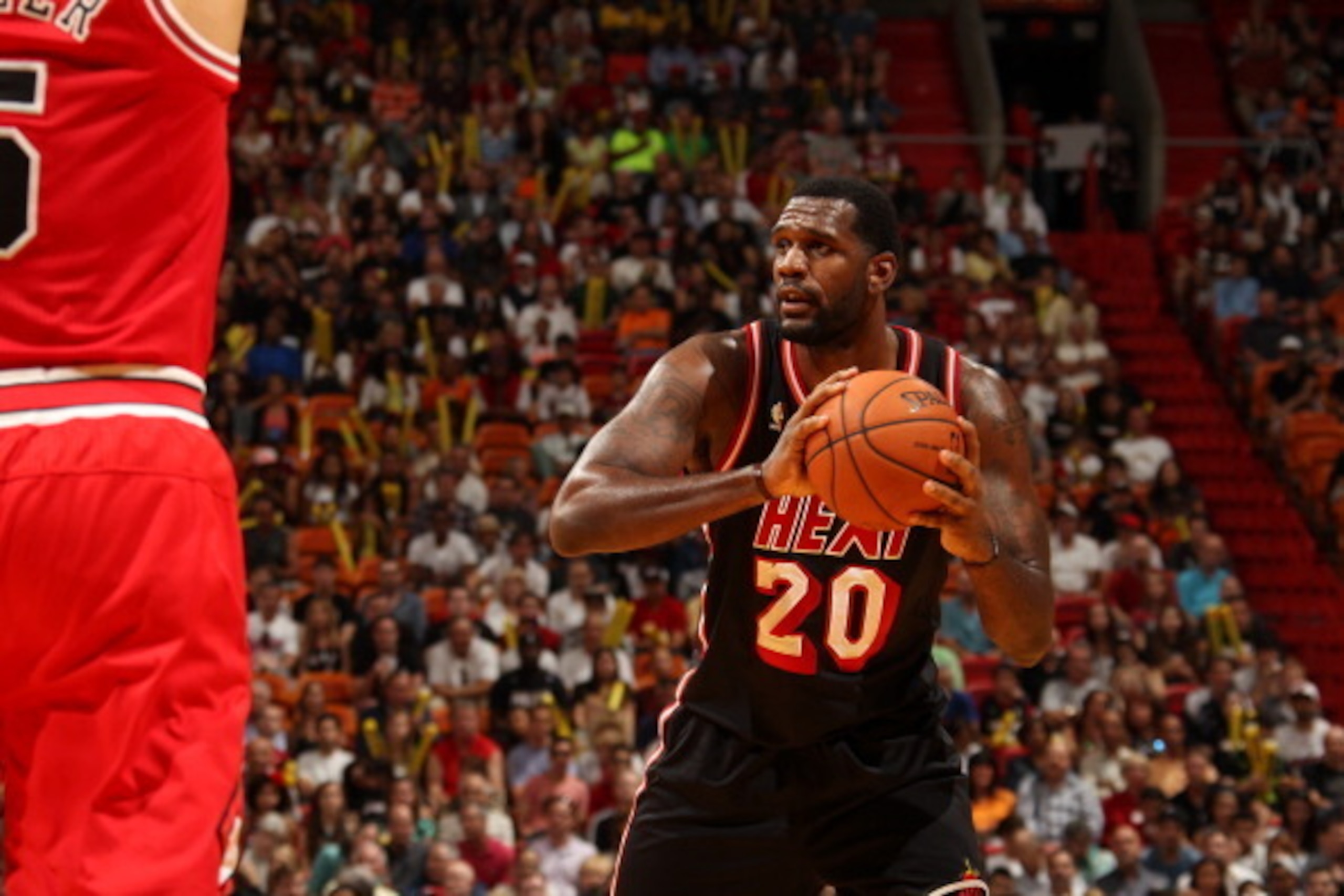 MIAMI, FL - February 23: Greg Oden #20 of the Miami Heat looks to pass the ball against the Chicago Bulls at the American Airlines Arena in Miami, Florida on Feb. 3, 2014. NOTE TO USER: User expressly acknowledges and agrees that, by downloading and/or us