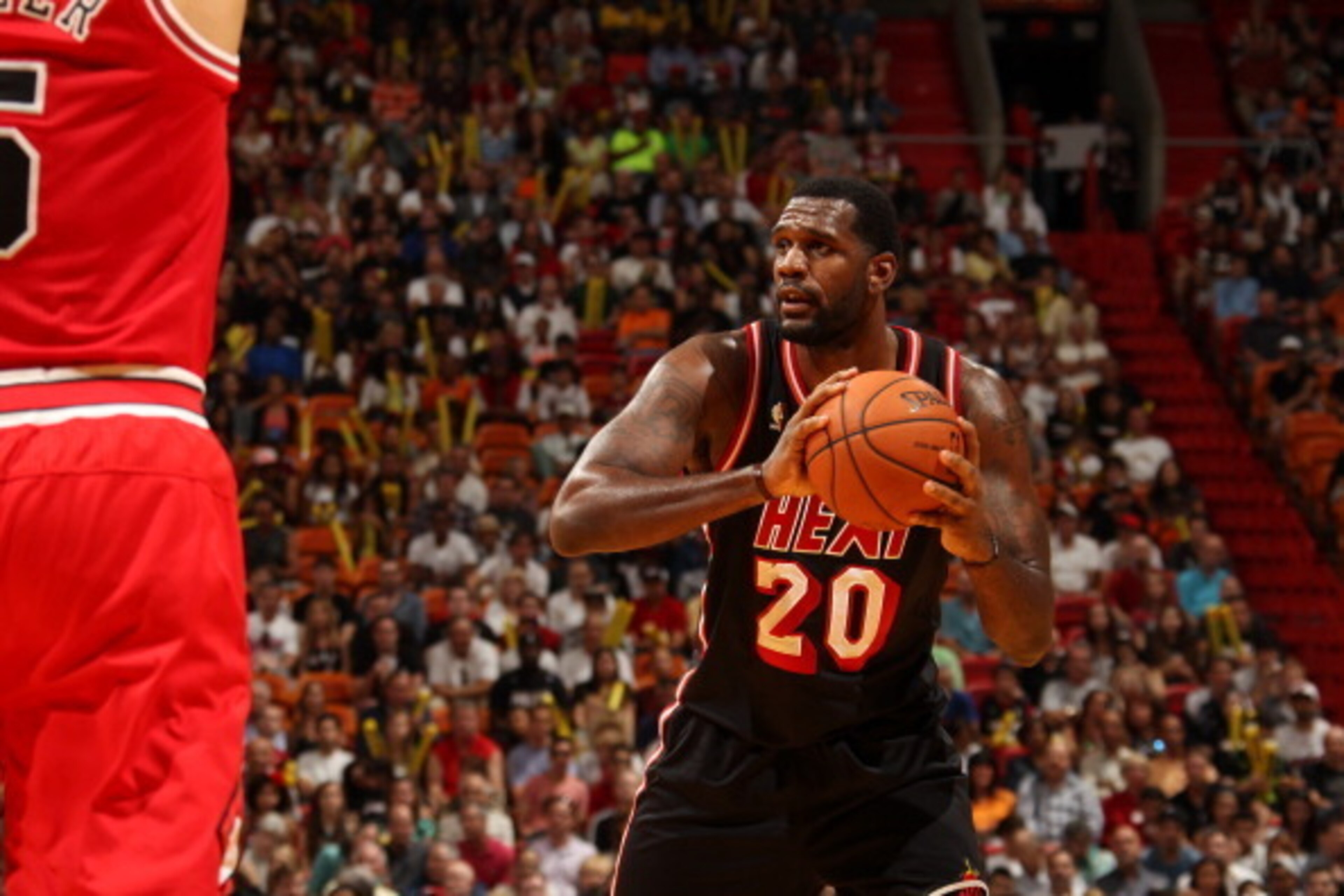 MIAMI, FL - February 23: Greg Oden #20 of the Miami Heat looks to pass the ball against the Chicago Bulls at the American Airlines Arena in Miami, Florida on Feb. 3, 2014. NOTE TO USER: User expressly acknowledges and agrees that, by downloading and/or us