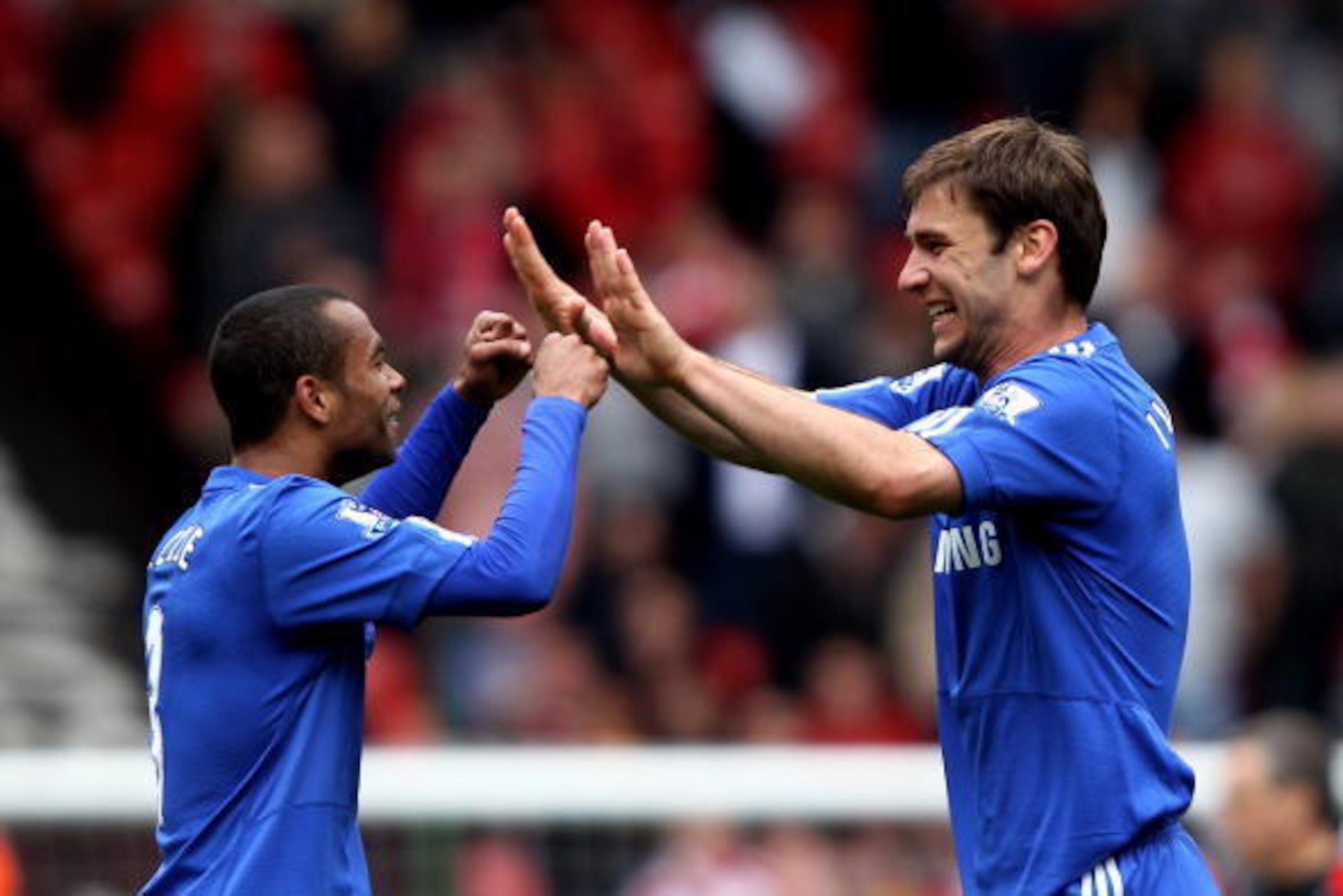 LIVERPOOL, ENGLAND - MAY 02:  Ashley Cole and Branislav Ivanovic of Chelsea celebrate following their team's 2-0 victory during the Barclays Premier League match between Liverpool and Chelsea at Anfield on May 2, 2010 in Liverpool, England.  (Photo by Cli