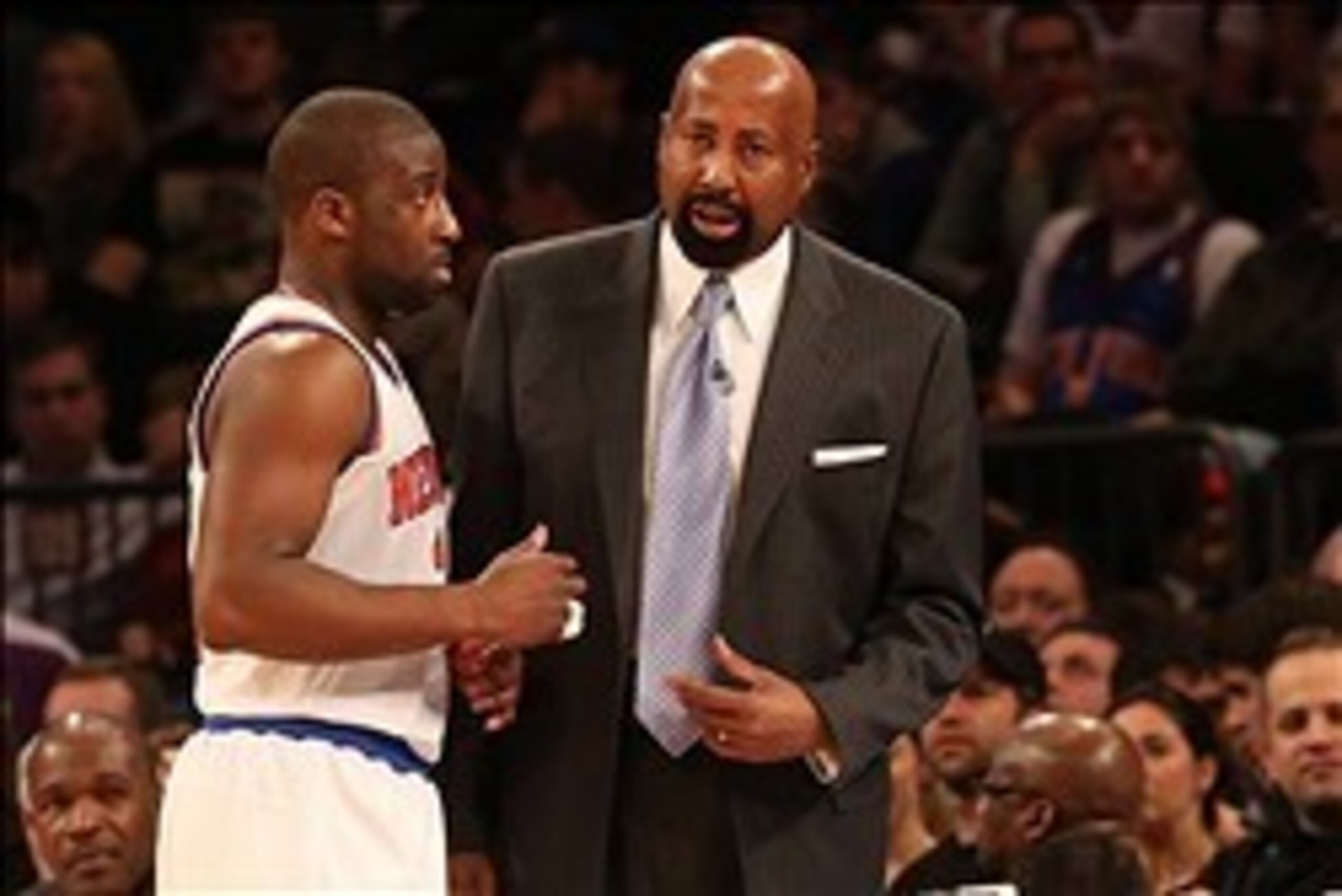 Jan 27, 2013; New York, NY, USA;  New York Knicks head coach Mike Woodson talks with point guard Raymond Felton (2) during the third quarter against the Atlanta Hawks at Madison Square Garden.  Knicks won 106-104.  Mandatory Credit: Anthony Gruppuso-USA T