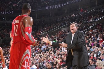 PORTLAND, OR - NOVEMBER 5:  Dwight Howard #12 and Kevin McHale of the Houston Rockets talk against the Portland Trail Blazers on November 5, 2013 at the Moda Center Arena in Portland, Oregon. NOTE TO USER: User expressly acknowledges and agrees that, by d