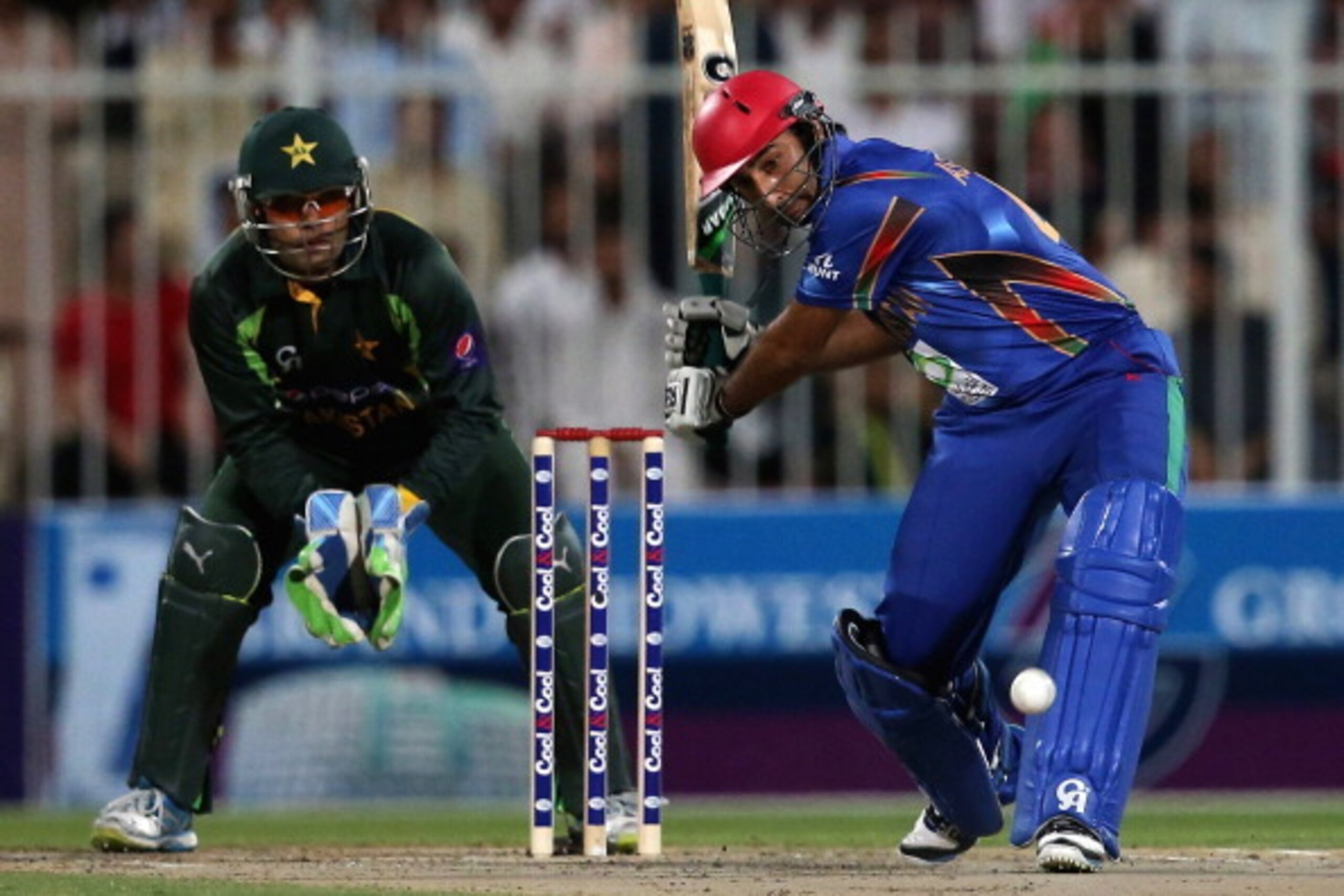 SHARJAH, UNITED ARAB EMIRATES - DECEMBER 08:  Nawroz Mangal of Afghanistan bats during the Twenty20 match between Afghanistan and Pakistan at the Sharjah Cricket Stadium on December 8, 2013 in Sharjha, United Arab Emirates.  (Photo by Francois Nel/Getty I