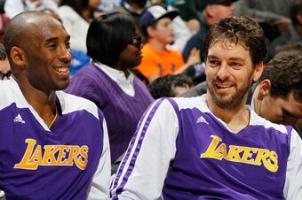 ATLANTA, GA - DECEMBER 16:  Kobe Bryant #24 and Pau Gasol #16 of the Los Angeles Lakers enjoy a laugh during the first half against the Atlanta Hawks at Philips Arena on December 16, 2013 in Atlanta, Georgia.  NOTE TO USER: User expressly acknowledges and