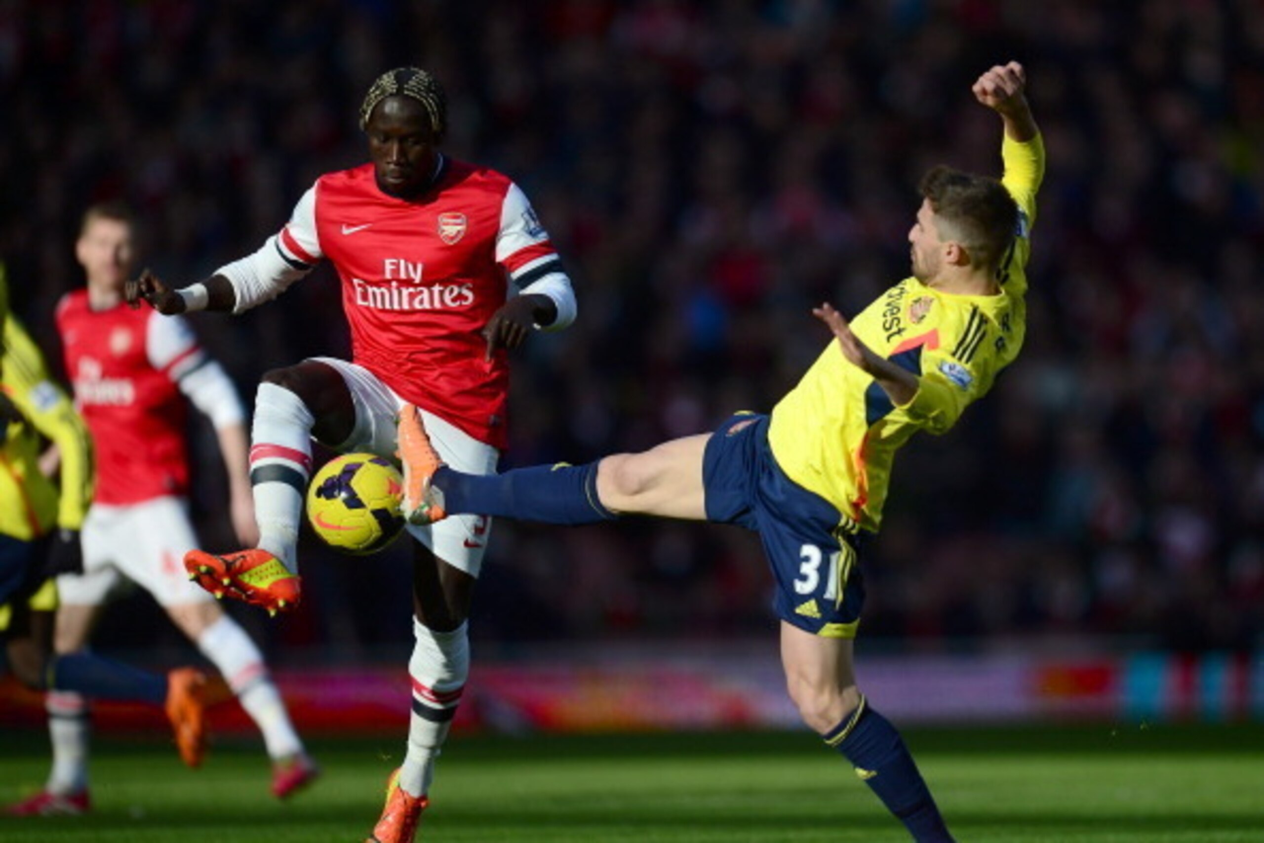 LONDON, ENGLAND - FEBRUARY 22:  Bacary Sagna of Arsenal (L) vies with Fabio Borini of Sunderland during the Barclays Premier League match between Arsenal and Sunderland at Emirates Stadium on February 22, 2014 in London, England.  (Photo by Jamie McDonald