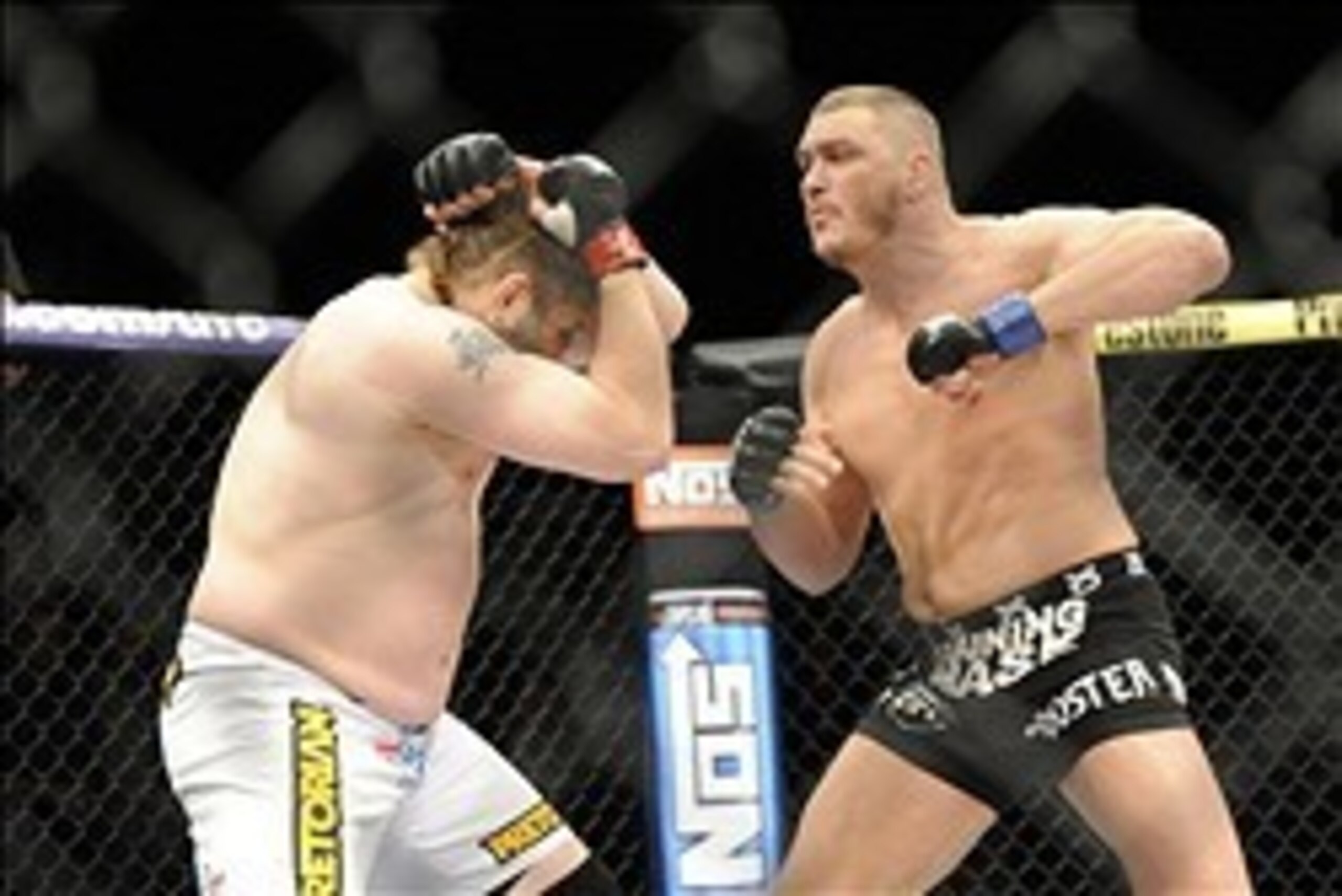 Dec 15, 2012; Las Vegas, NV, USA; Roy Nelson (left) is punched by Matt Mitrione (right) during their heavyweight bout in the Ultimate Fighter Finale at The Joint at the Hard Rock Hotel and Casino. Nelson won by KO. Mandatory Credit: Josh Holmberg-USA TODA Dec 15, 2012; Las Vegas, NV, USA; Roy Nelson (left) is punched by Matt Mitrione (right) during their heavyweight bout in the Ultimate Fighter Finale at The Joint at the Hard Rock Hotel and Casino. Nelson won by KO. Mandatory Credit: Josh Holmberg-USA TODA