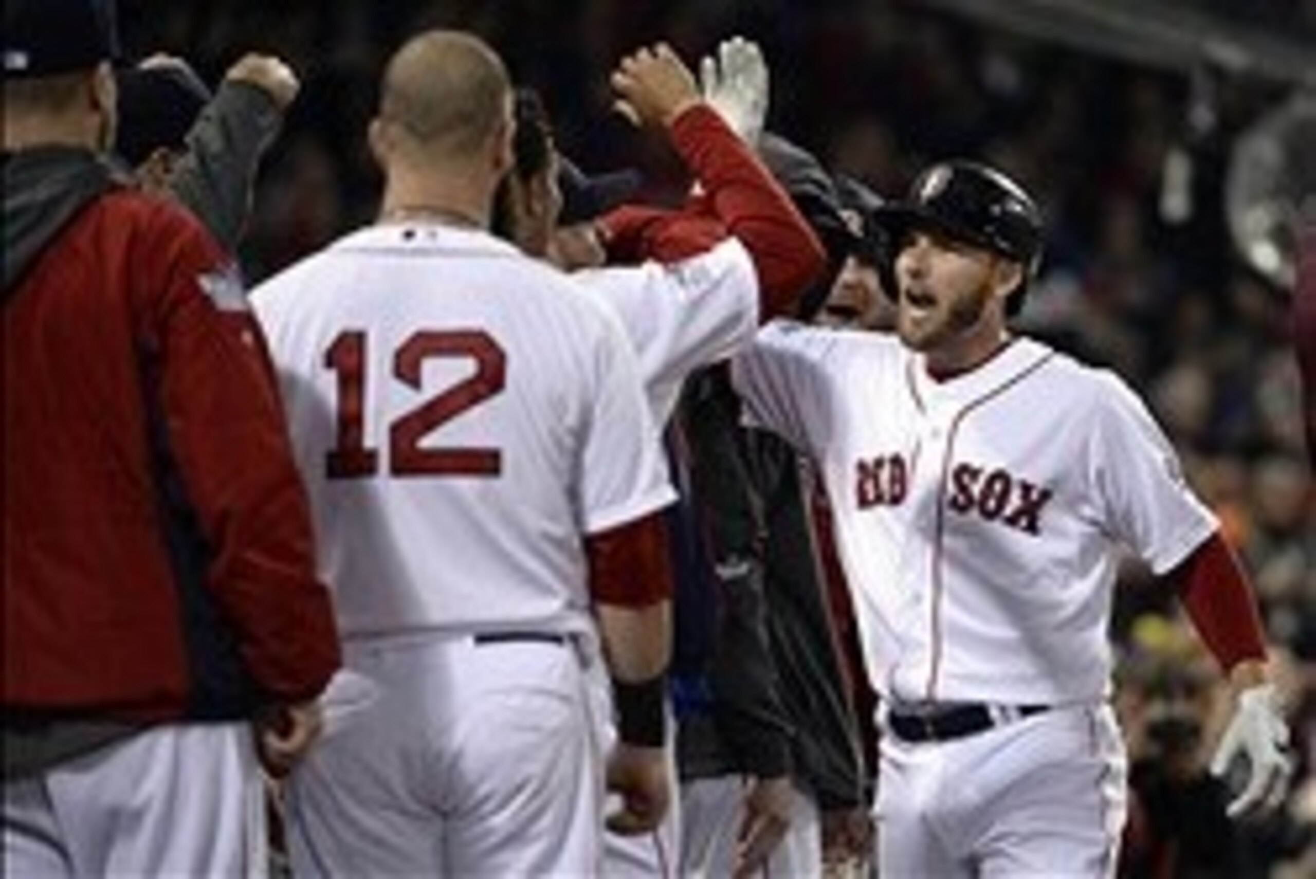 Oct 30, 2013; Boston, MA, USA; Boston Red Sox shortstop Stephen Drew (right) is congratulated by teammates in the dugout after hitting a solo home run against the St. Louis Cardinals in the fourth inning during game six of the MLB baseball World Series at