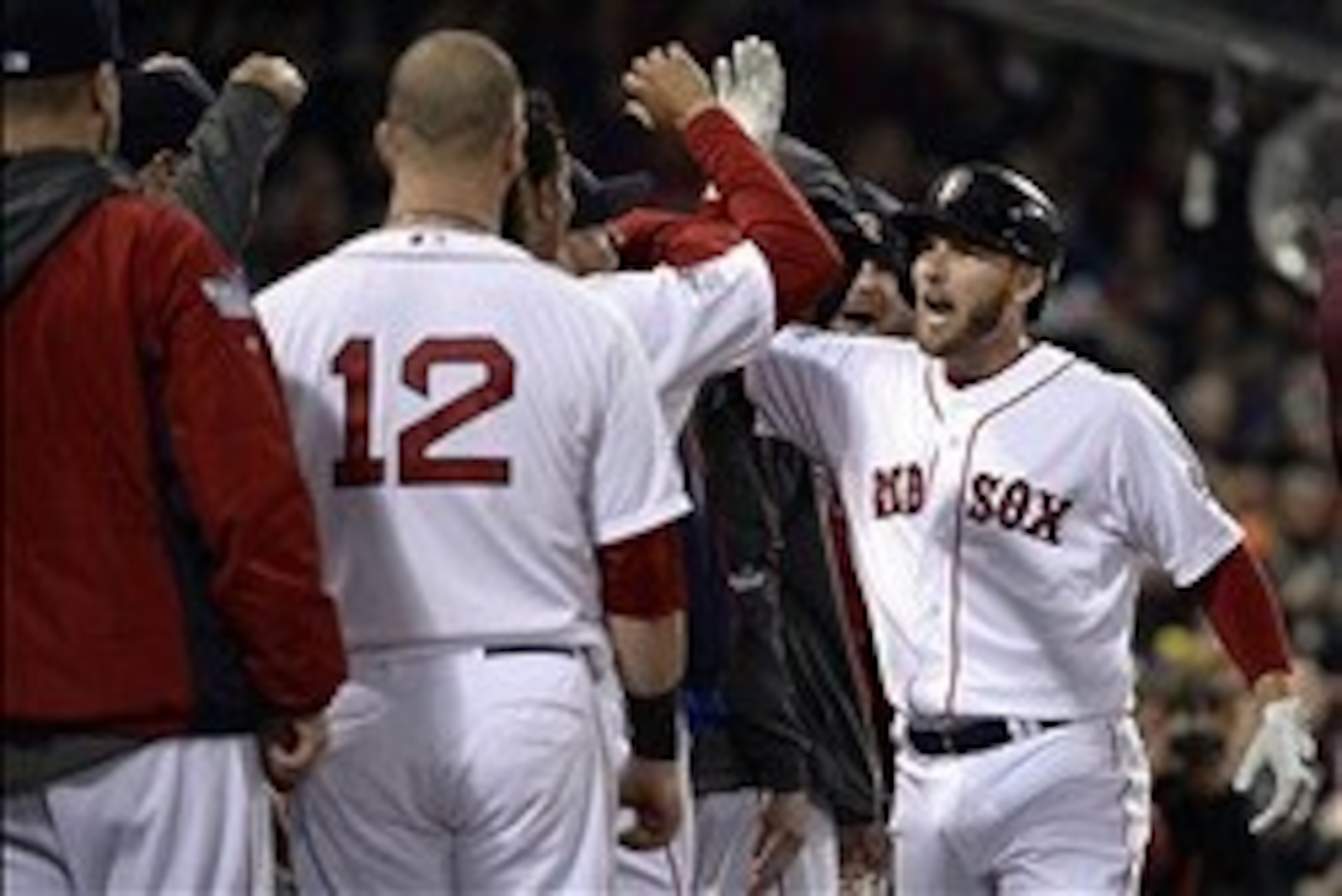Oct 30, 2013; Boston, MA, USA; Boston Red Sox shortstop Stephen Drew (right) is congratulated by teammates in the dugout after hitting a solo home run against the St. Louis Cardinals in the fourth inning during game six of the MLB baseball World Series at