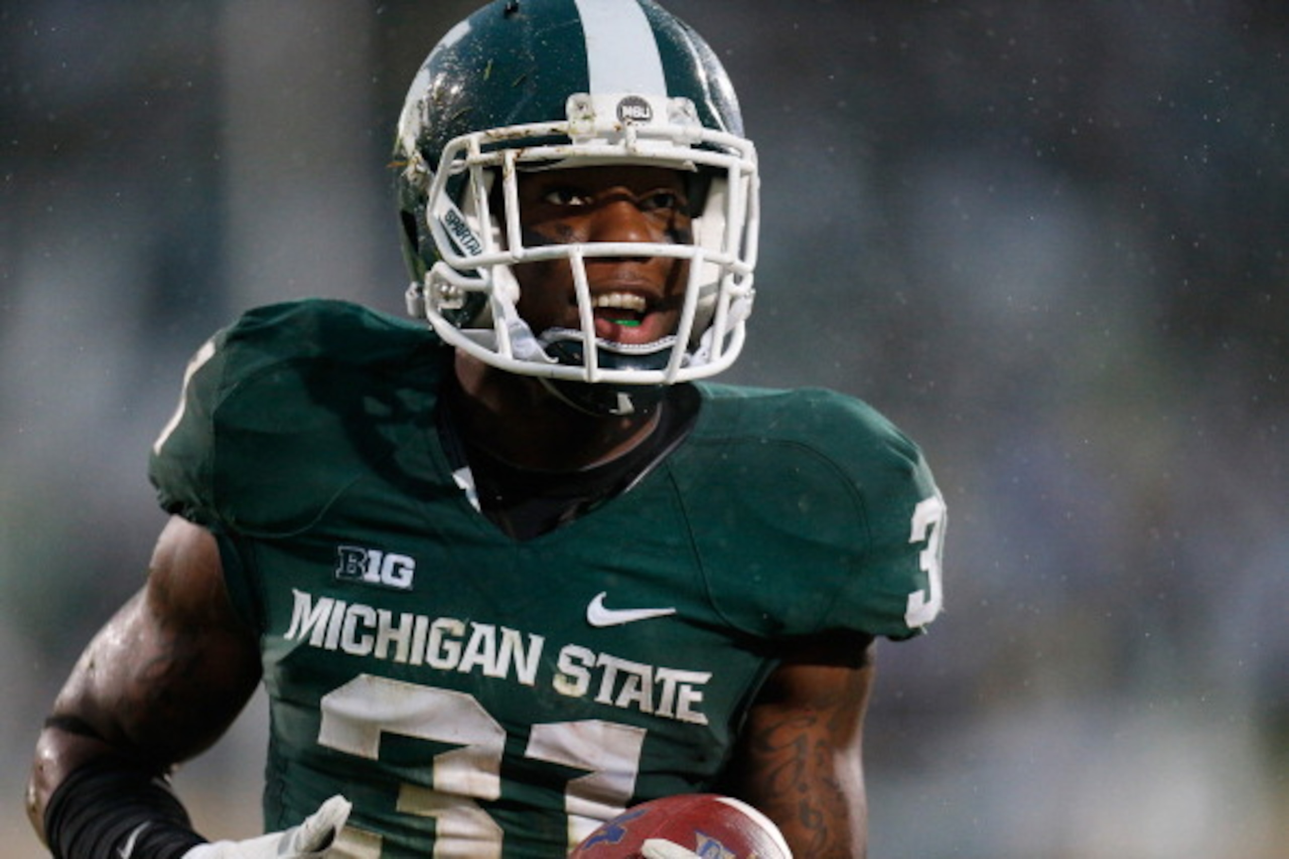 EAST LANSING, MI - NOVEMBER 02: Darqueze Dennard #31 of the Michigan State Spartans celebrates his fourth-quarter interception against the Michigan Wolverines at Spartan Stadium on November 2, 2013 in East Lansing, Michigan. Michigan State won the game 2 EAST LANSING, MI - NOVEMBER 02: Darqueze Dennard #31 of the Michigan State Spartans celebrates his fourth-quarter interception against the Michigan Wolverines at Spartan Stadium on November 2, 2013 in East Lansing, Michigan. Michigan State won the game 2