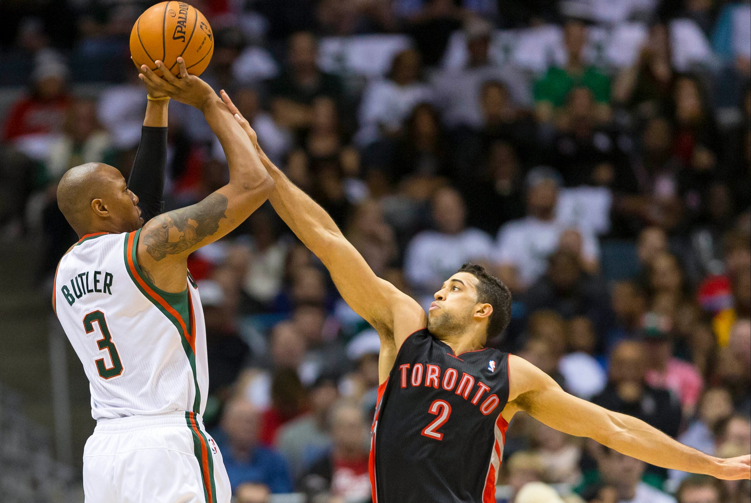 Nov 2, 2013; Milwaukee, WI, USA; Milwaukee Bucks forward Caron Butler (3) shoots against Toronto Raptors forward Landry Fields (2) during the second quarter at BMO Harris Bradley Center. Mandatory Credit: Jeff Hanisch-USA TODAY Sports