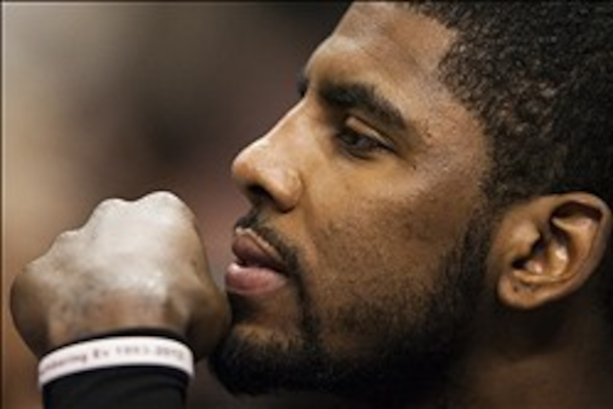 Feb 18, 2014; Philadelphia, PA, USA; Cleveland Cavaliers guard Kyrie Irving (2) watches from the bench during the fourth quarter against the Philadelphia 76ers at the Wells Fargo Center. The Cavaliers defeated the Sixers 114-85. Mandatory Credit: Howard S