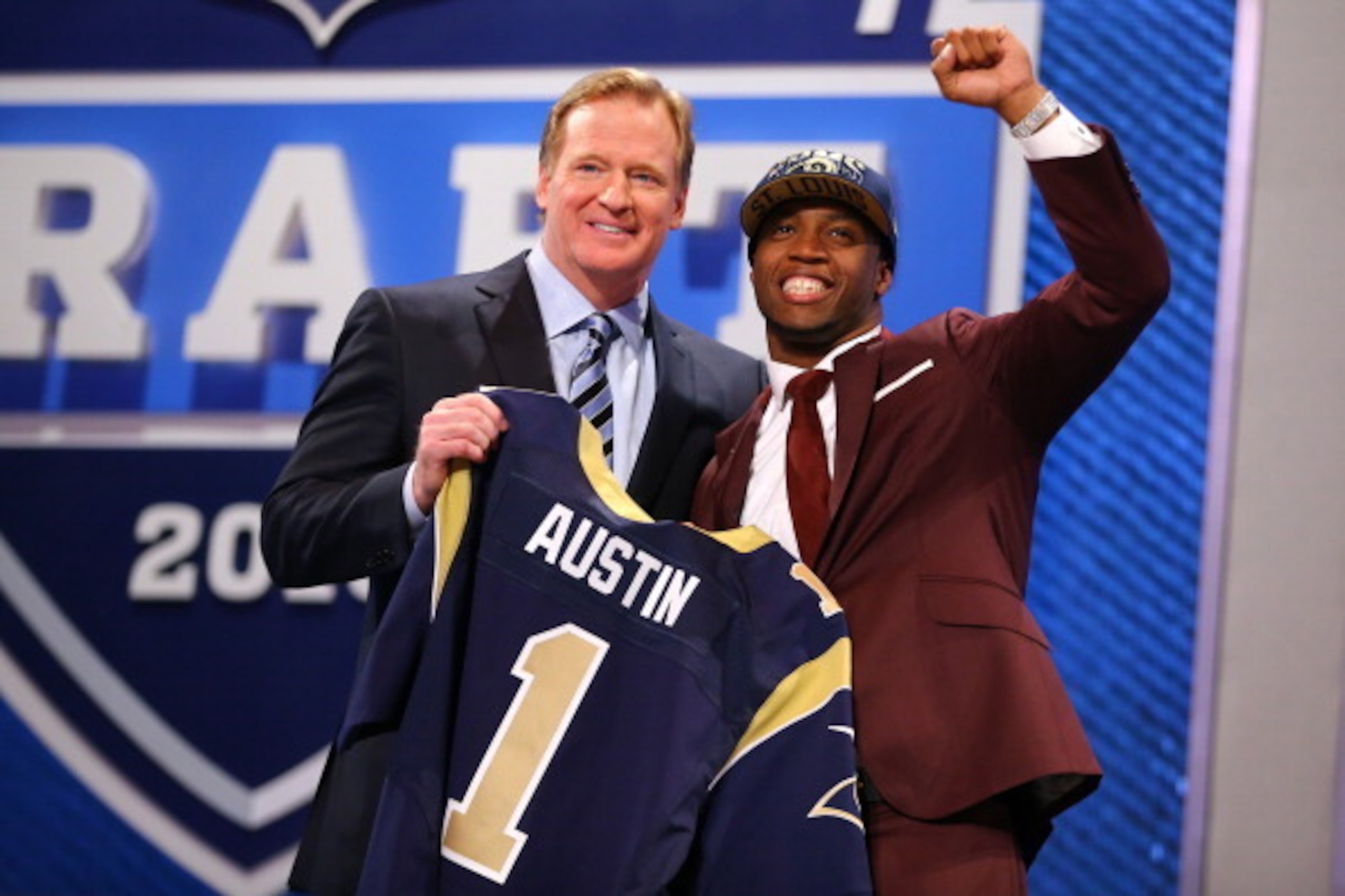 NEW YORK, NY - APRIL 25:  Tavon Austin (R) of West Virginia Mountaineers reacts with NFL Commissioner Roger Goodell as they hold up a jersey on stage after Austin was picked #8 overall by the St. Louis Rams in the first round of the 2013 NFL Draft at Radi