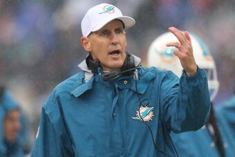 ORCHARD PARK, NY - DECEMBER 22: Head coach Joe Philbin of the Miami Dolphins motions from the sideline during NFL game action against the Buffalo Bills at Ralph Wilson Stadium on December 22, 2013 in Orchard Park, New York. (Photo by Tom Szczerbowski/Gett