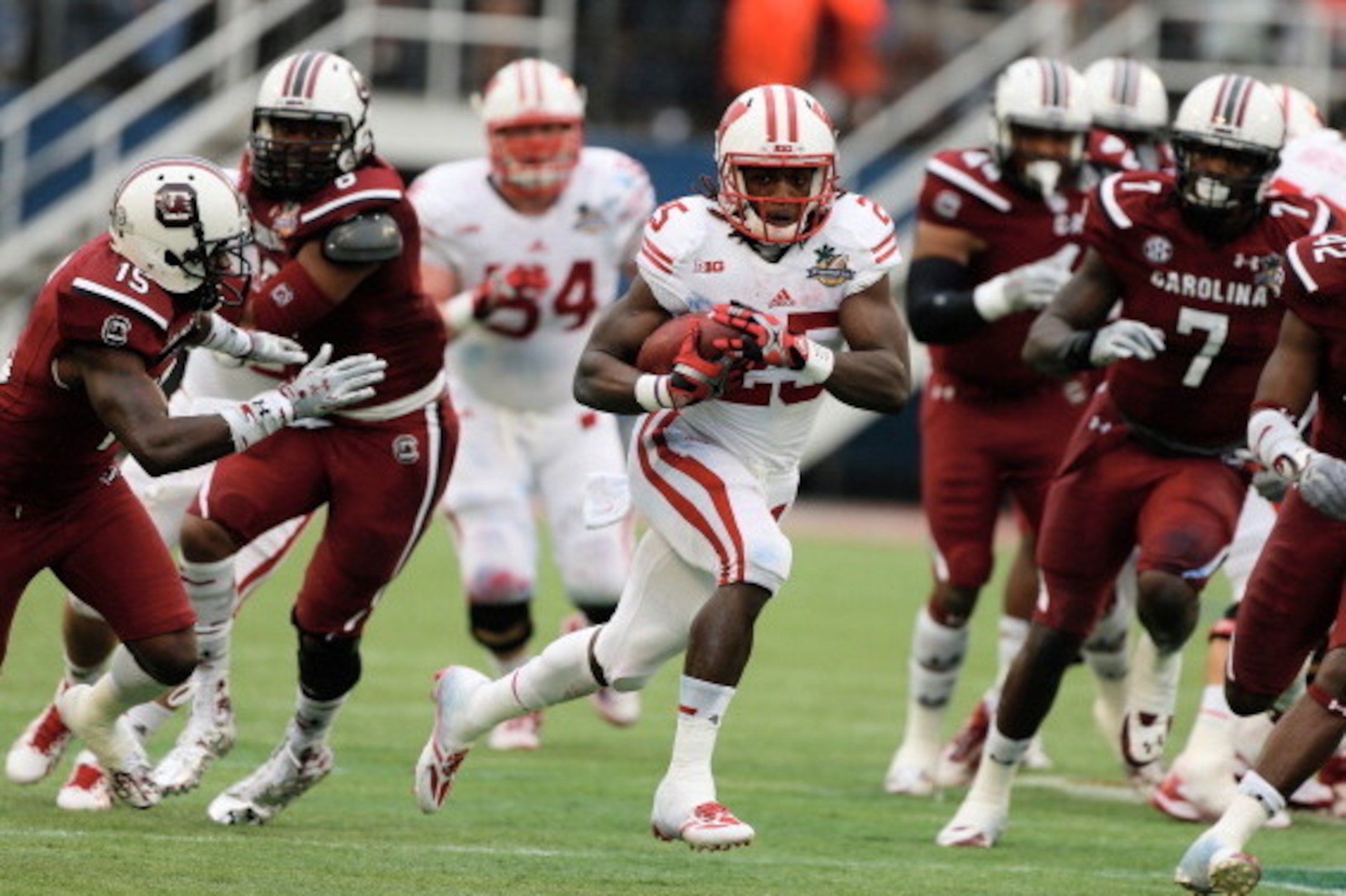 ORLANDO, FL - JANUARY 01:  Melvin Gordon #25 of the Wisconsin Badgers runs for a big gain in the first half against the South Carolina Gamecocks during the Capital One Bowl on January 1, 2014 in Orlando, Florida.  (Photo by Scott Halleran/Getty Images)