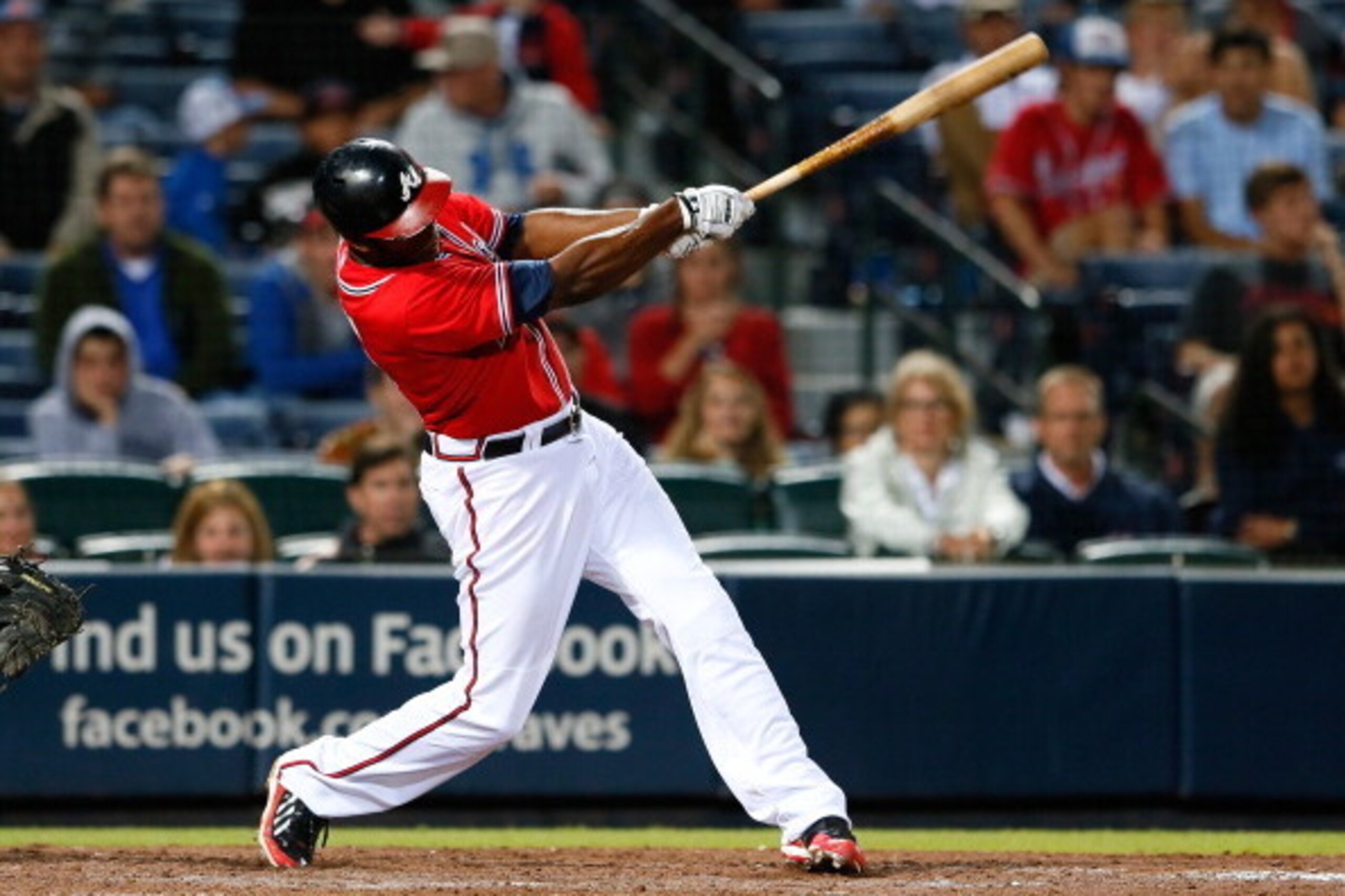 ATLANTA, GA - AUGUST 16:  Justin Upton #8 of the Atlanta Braves hits a solo walk-off homer in the 10th inning against the Washington Nationals at Turner Field on August 16, 2013 in Atlanta, Georgia.  (Photo by Kevin C. Cox/Getty Images)