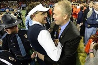 Dec 7, 2013; Atlanta, GA, USA; Auburn Tigers head coach Gus Malzahn celebrates with athletic director Jay Jacobs after the 2013 SEC Championship game against the Missouri Tigers at Georgia Dome. Auburn won 59-42. Mandatory Credit: John David Mercer-USA TO