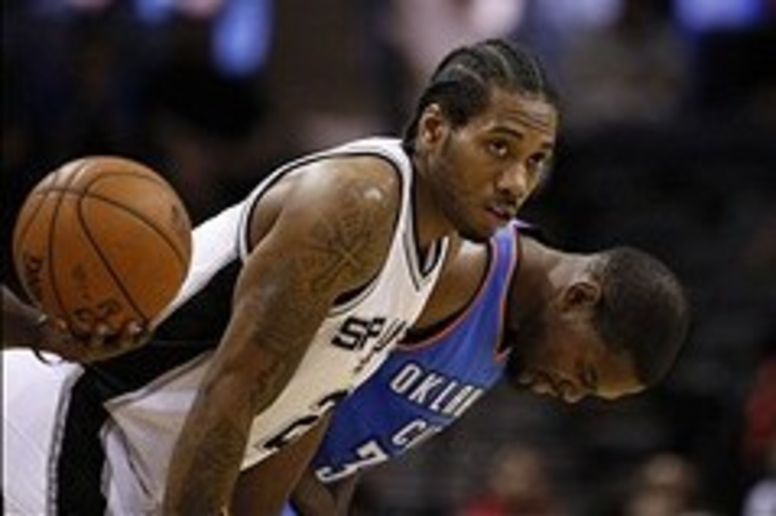Jan 22, 2014; San Antonio, TX, USA; San Antonio Spurs forward Kawhi Leonard (2) and Oklahoma City Thunder forward Kevin Durant (35) before the tip off at AT&T Center. Mandatory Credit: Soobum Im-USA TODAY Sports
