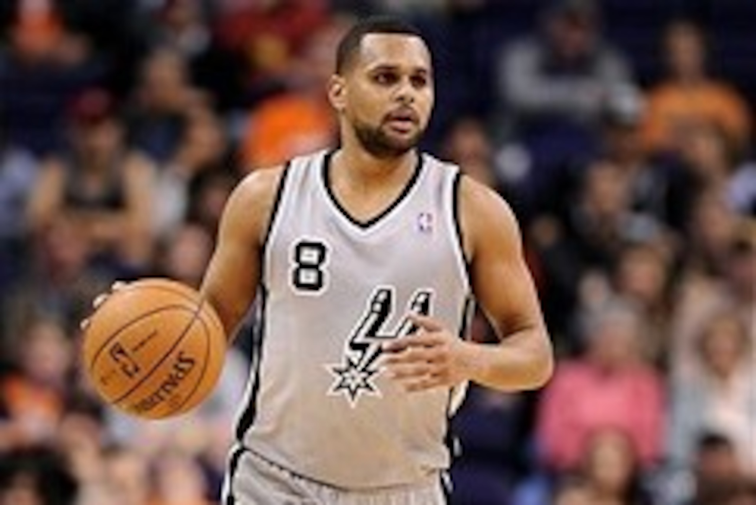 Feb. 24, 2013; Phoenix, AZ, USA; San Antonio Spurs guard Patty Mills (8) dribbles the ball up the court against the Phoenix Suns in the second half at US Airways Center. The Spurs defeated the Suns 97-87. Mandatory Credit: Jennifer Stewart-USA TODAY Sport