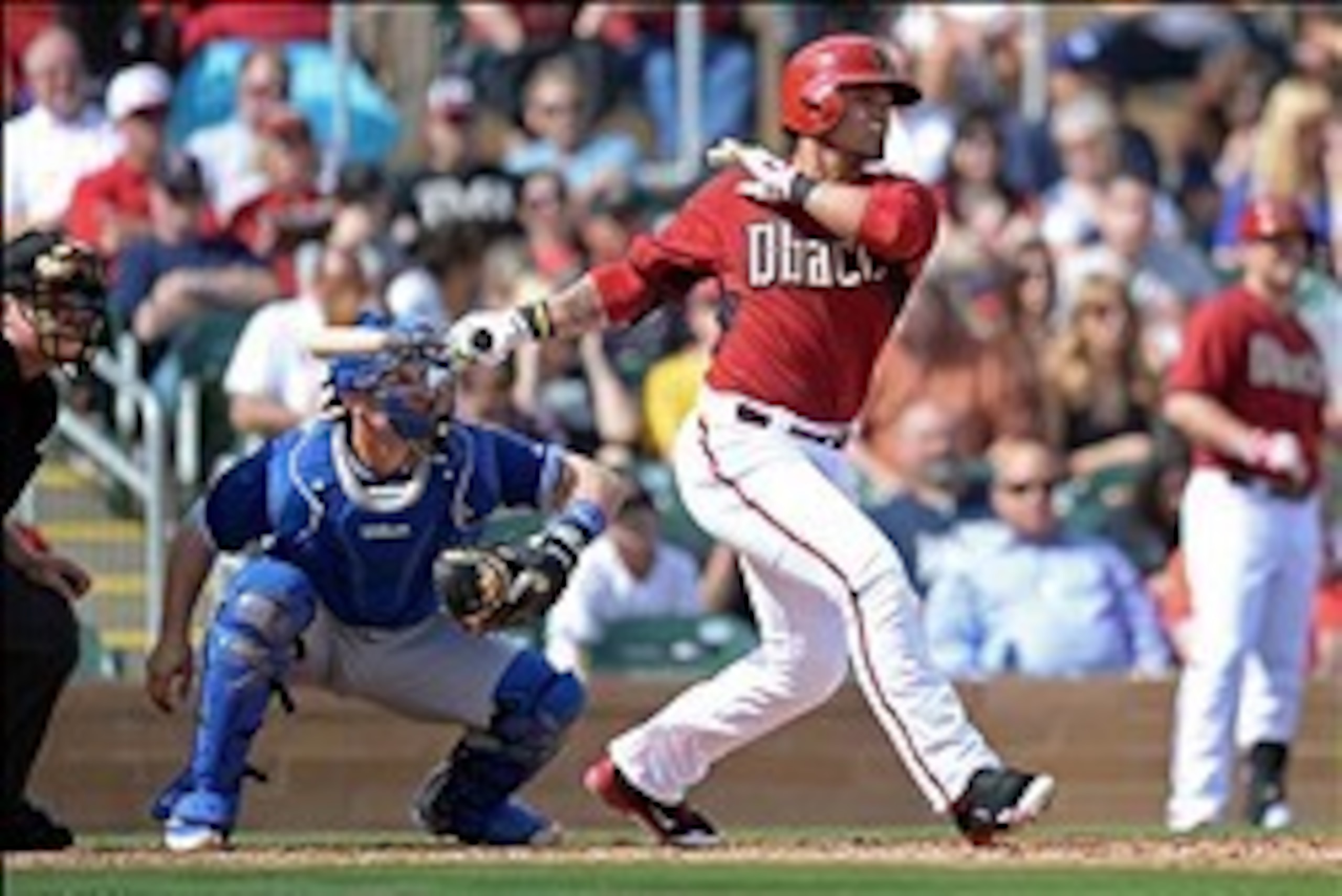 Feb 26, 2014; Salt River Pima-Maricopa, AZ, USA; Arizona Diamondbacks center fielder Gerardo Parra (8) hits a triple against the Los Angeles Dodgers during the second inning at Salt River Fields at Talking Stick. Mandatory Credit: Joe Camporeale-USA TODAY