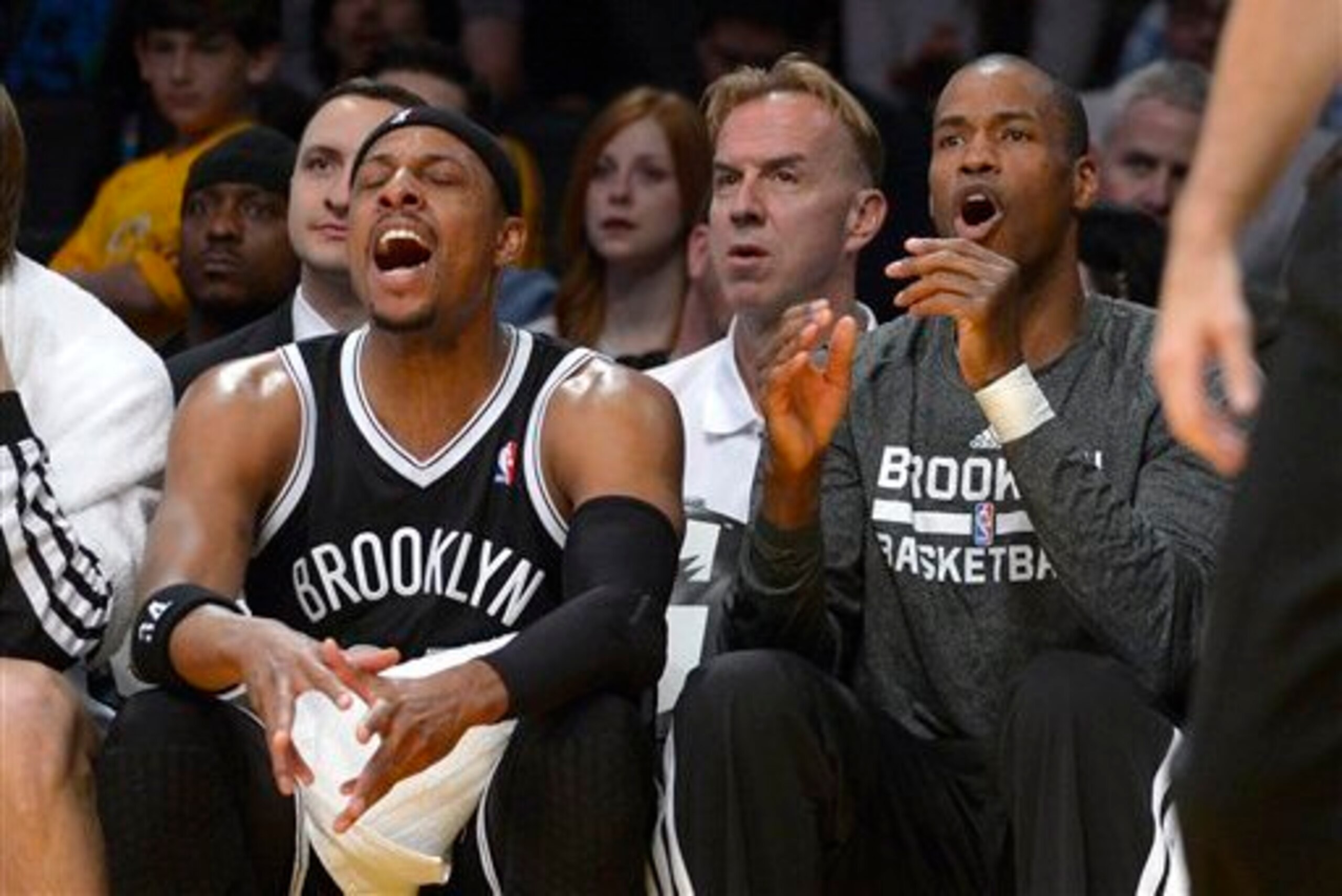 Paul Pierce and Jason Collins cheer on their teammates from the bench in L.A.