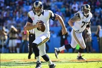 Oct 20, 2013; Charlotte, NC, USA; St. Louis Rams quarterback Sam Bradford (8) runs with the ball and is injured on the play against the Carolina Panthers at Bank of America Stadium. Mandatory Credit: Bob Donnan-USA TODAY Sports