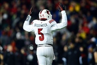Dec 5, 2013; Cincinnati, OH, USA; Louisville Cardinals quarterback Teddy Bridgewater (5) reacts to a touchdown during the fourth quarter against the Cincinnati Bearcats at Nippert Stadium. Mandatory Credit: Andrew Weber-USA TODAY Sports