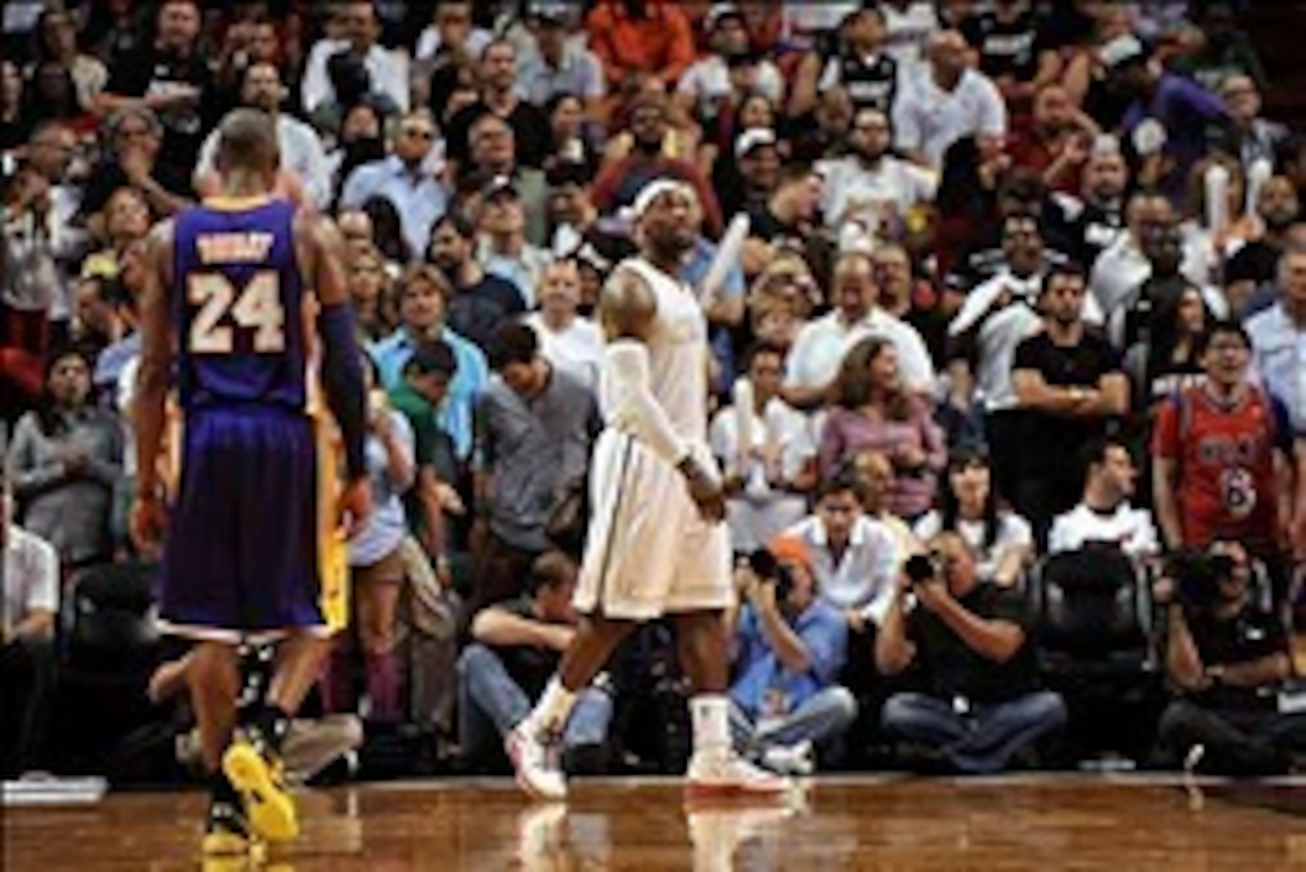 Feb 10, 2013; Miami, FL, USA; Miami Heat small forward LeBron James (6) and Los Angeles Lakers shooting guard Kobe Bryant (24) during the second half at American Airlines Arena. Mandatory Credit: Steve Mitchell-USA TODAY Sports