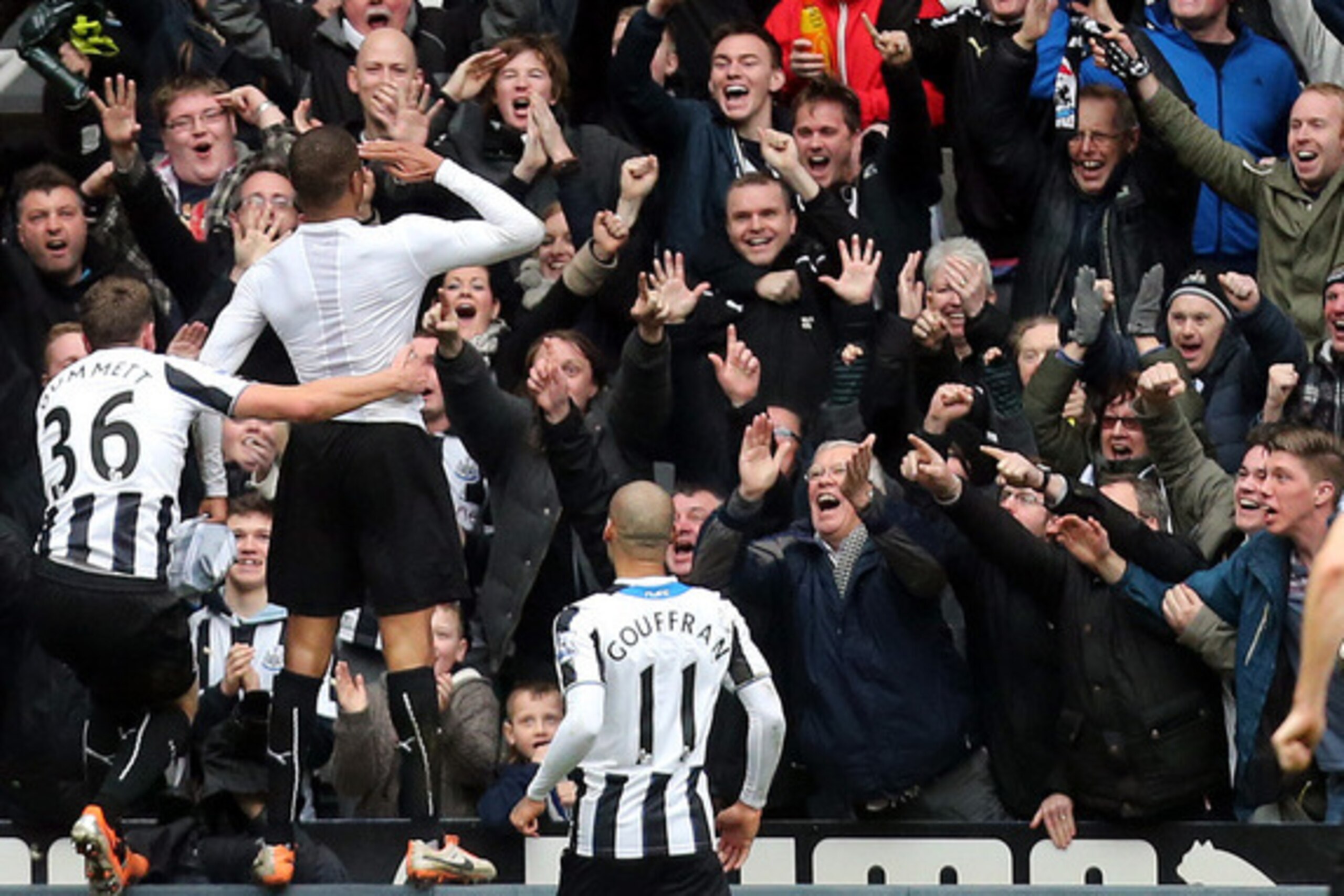 Remy celebrates, with Mike Williamson quick to join in (bottom right corner).