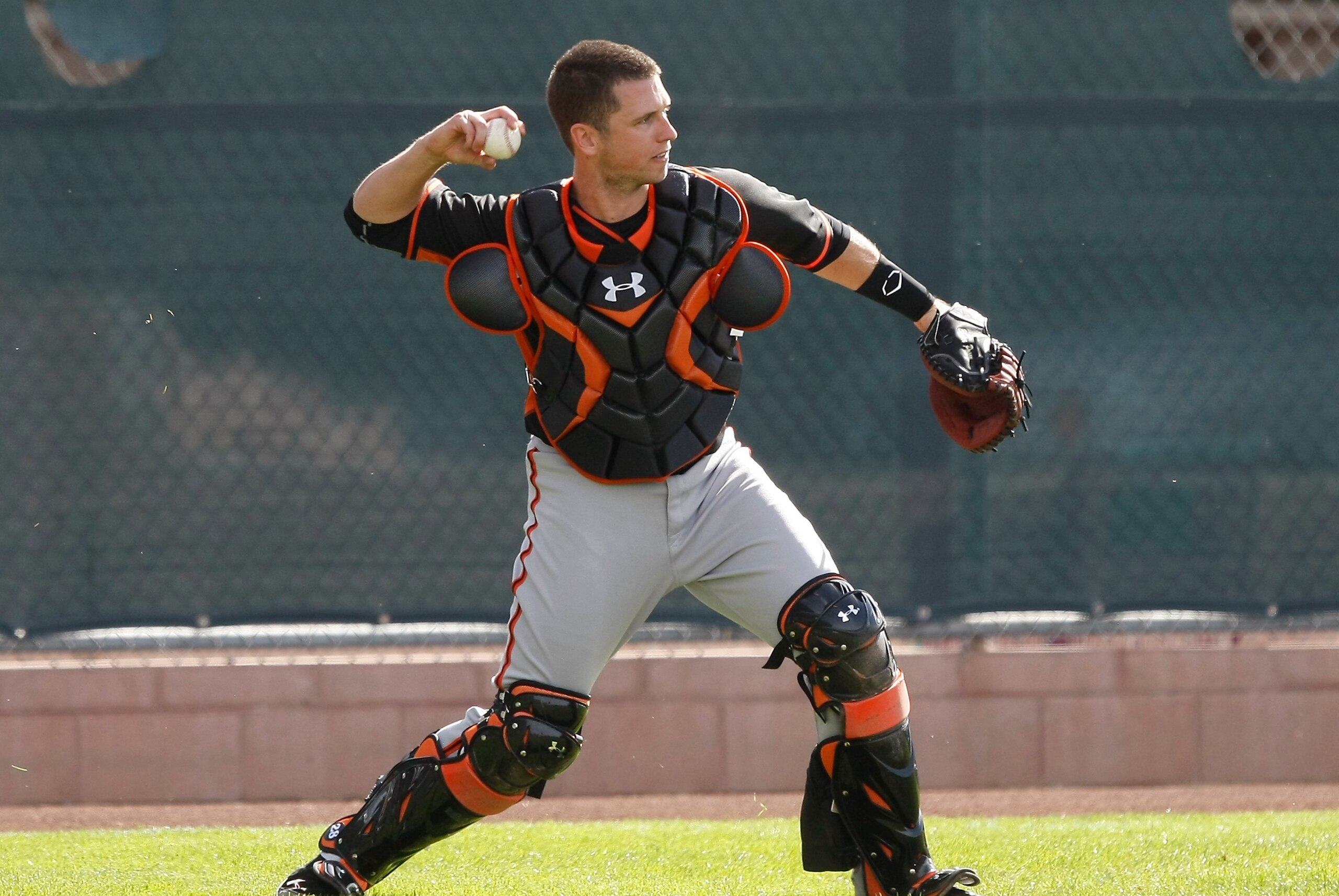 Feb 16, 2014; Scottsdale, AZ, USA; San Francisco Giants catcher Buster Posey (28) warms up during camp at Scottsdale Stadium. Mandatory Credit: Rick Scuteri-USA TODAY Sports