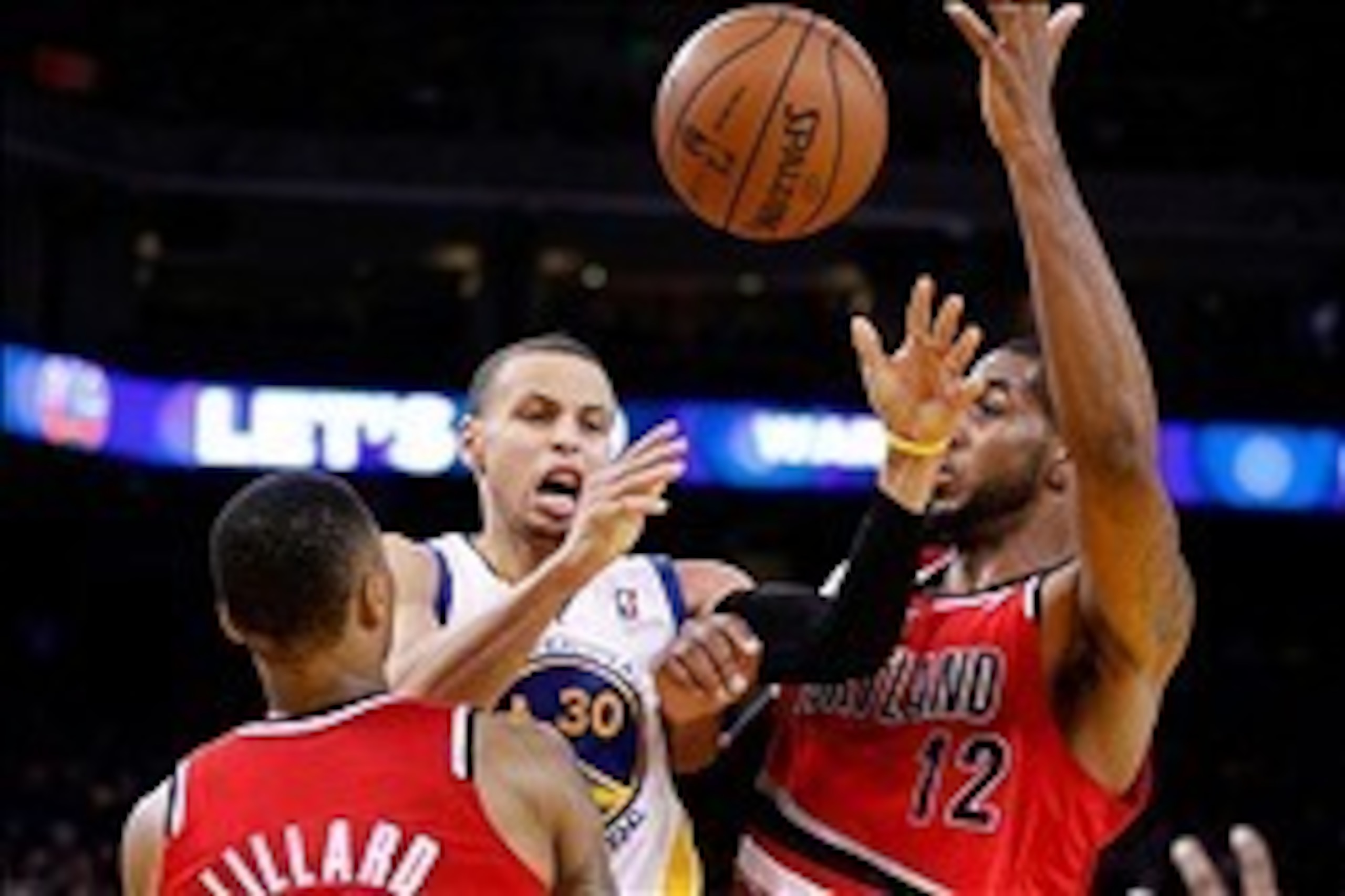 Jan 26, 2014; Oakland, CA, USA; Golden State Warriors guard Stephen Curry (30) is fouled by Portland Trail Blazers guard Damian Lillard (0) while attempting a shot in the fourth quarter at Oracle Arena. The Warriors defeated the Trail Blazers 103-88. Mand Jan 26, 2014; Oakland, CA, USA; Golden State Warriors guard Stephen Curry (30) is fouled by Portland Trail Blazers guard Damian Lillard (0) while attempting a shot in the fourth quarter at Oracle Arena. The Warriors defeated the Trail Blazers 103-88. Mand