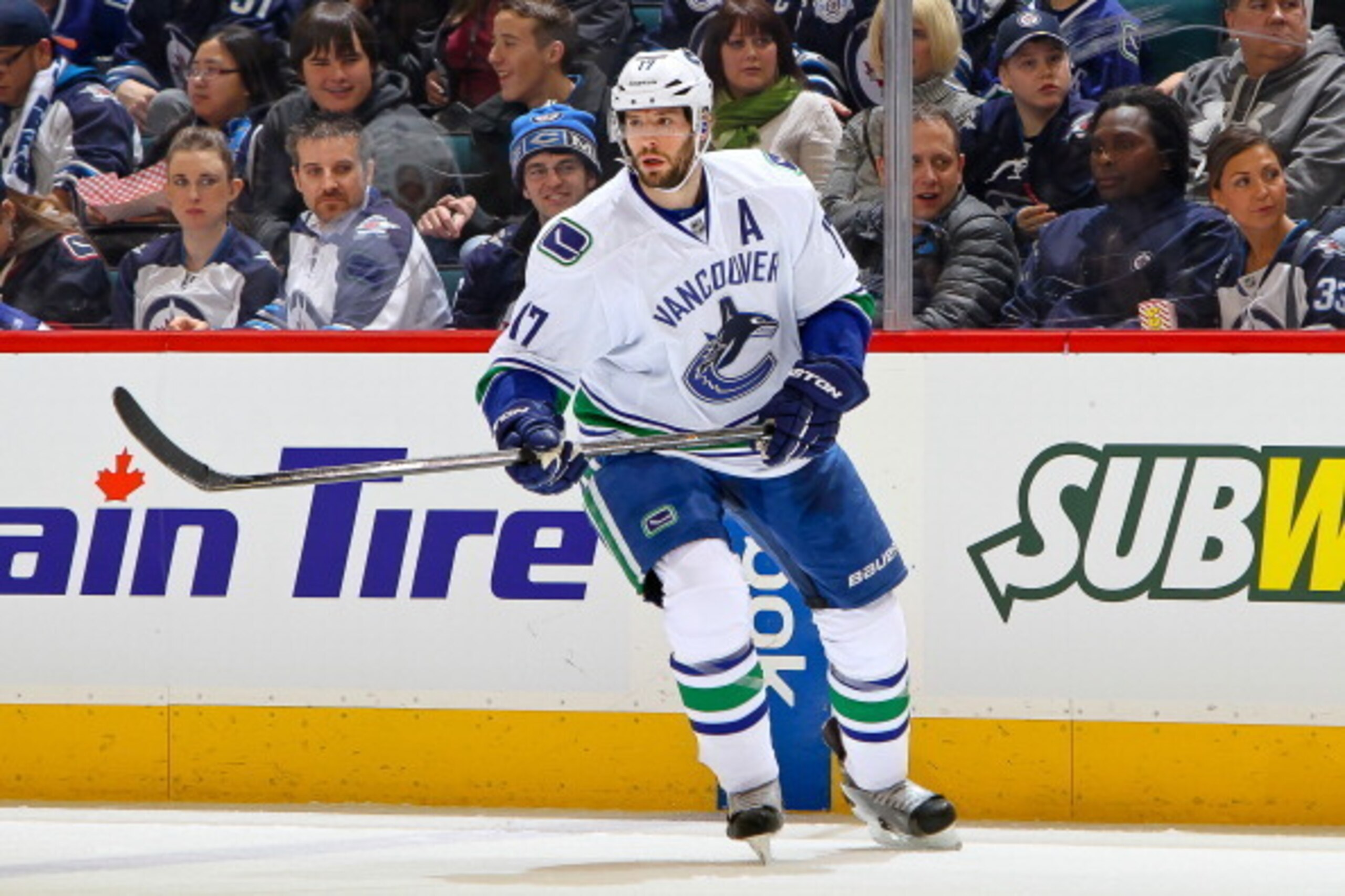 WINNIPEG, MB - JANUARY 31: Ryan Kesler #17 of the Vancouver Canucks keeps an eye on the play during second period action against the Winnipeg Jets at the MTS Centre on January 31, 2014 in Winnipeg, Manitoba, Canada. The Jets defeated the Canucks 4-3. (Pho