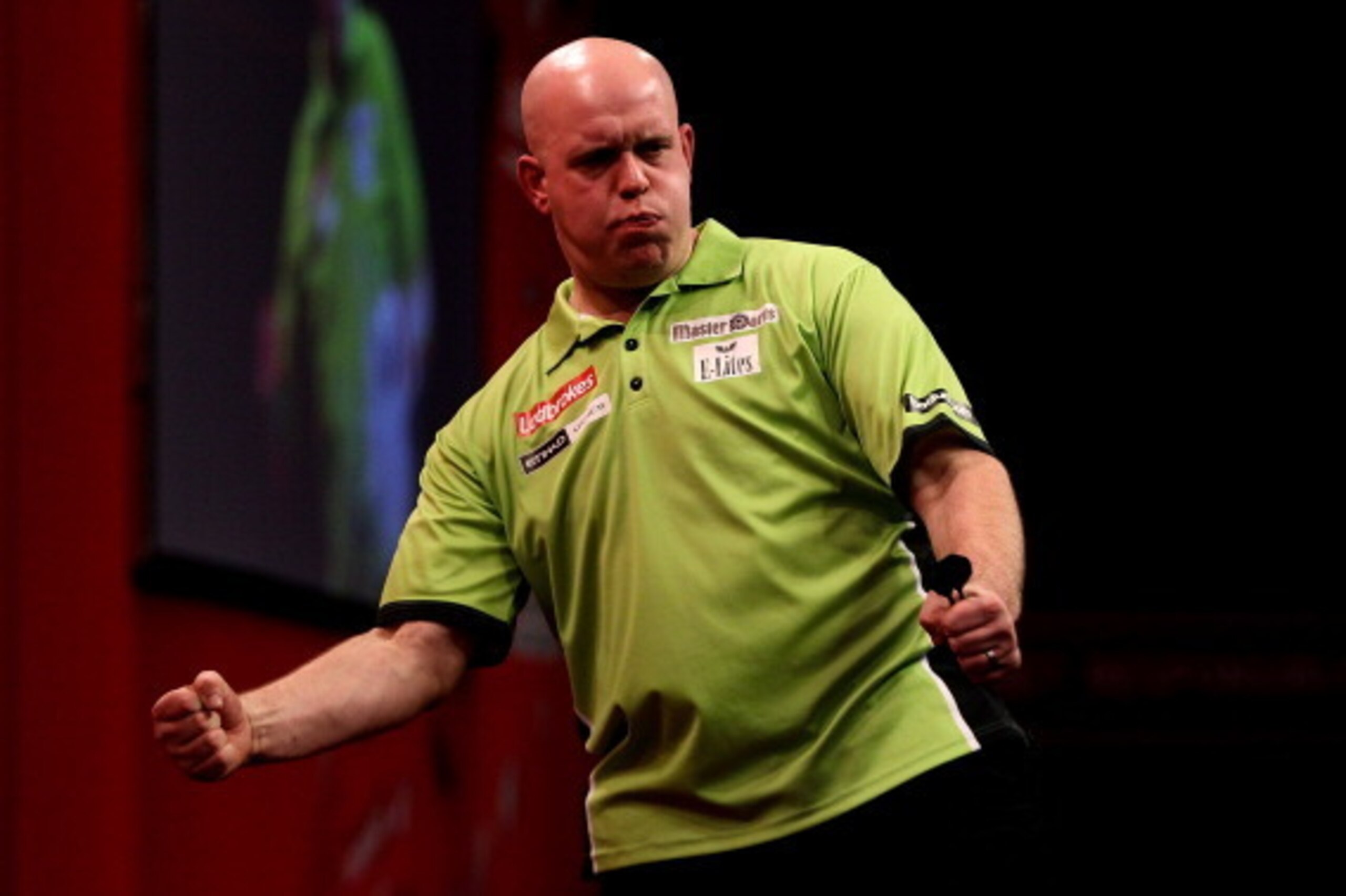 LONDON, ENGLAND - DECEMBER 30:  Michael van Gerwen of The Netherlands celebrates victory after defeating Adrian Lewis of England in their semi final match on day fifteen of the Ladbrokes.com World Darts Championship at Alexandra Palace on December 30, 201