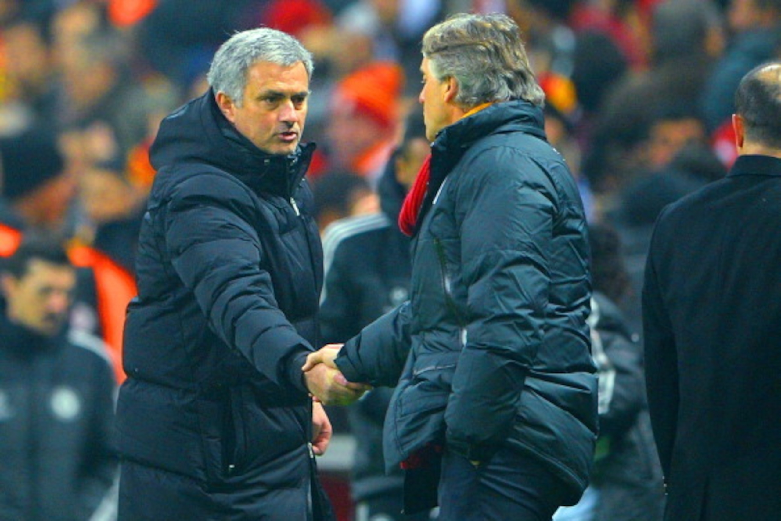 ISTANBUL, TURKEY - FEBRUARY 26:  Jose Mourinho manager of Chelsea shakes hands with Head Coach Roberto Mancini of Galatasaray at the final whistle during the UEFA Champions League Round of 16 first leg match between Galatasaray AS and Chelsea at Ali Sami 