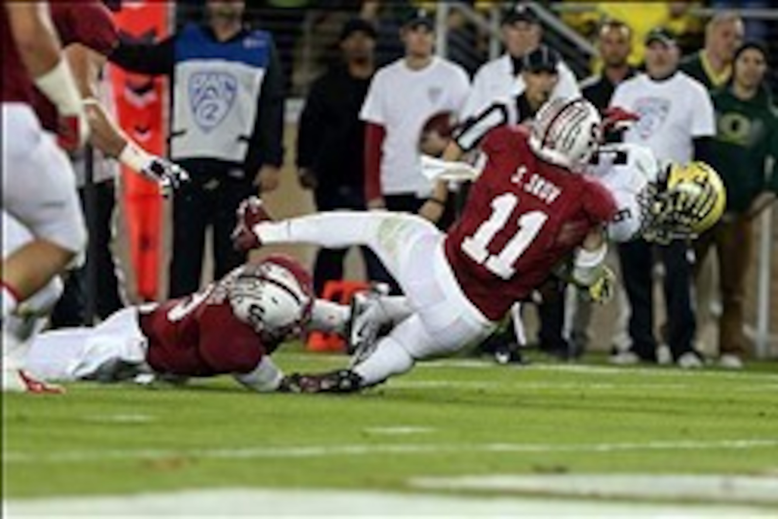 Nov 7, 2013; Stanford, CA, USA; Stanford Cardinal linebacker Shayne Skov (11) tackles Oregon Ducks running back De'Anthony Thomas (6) forcing a fumble and recovering the ball during the second quarter at Stanford Stadium. Mandatory Credit: Kelley L Cox-US