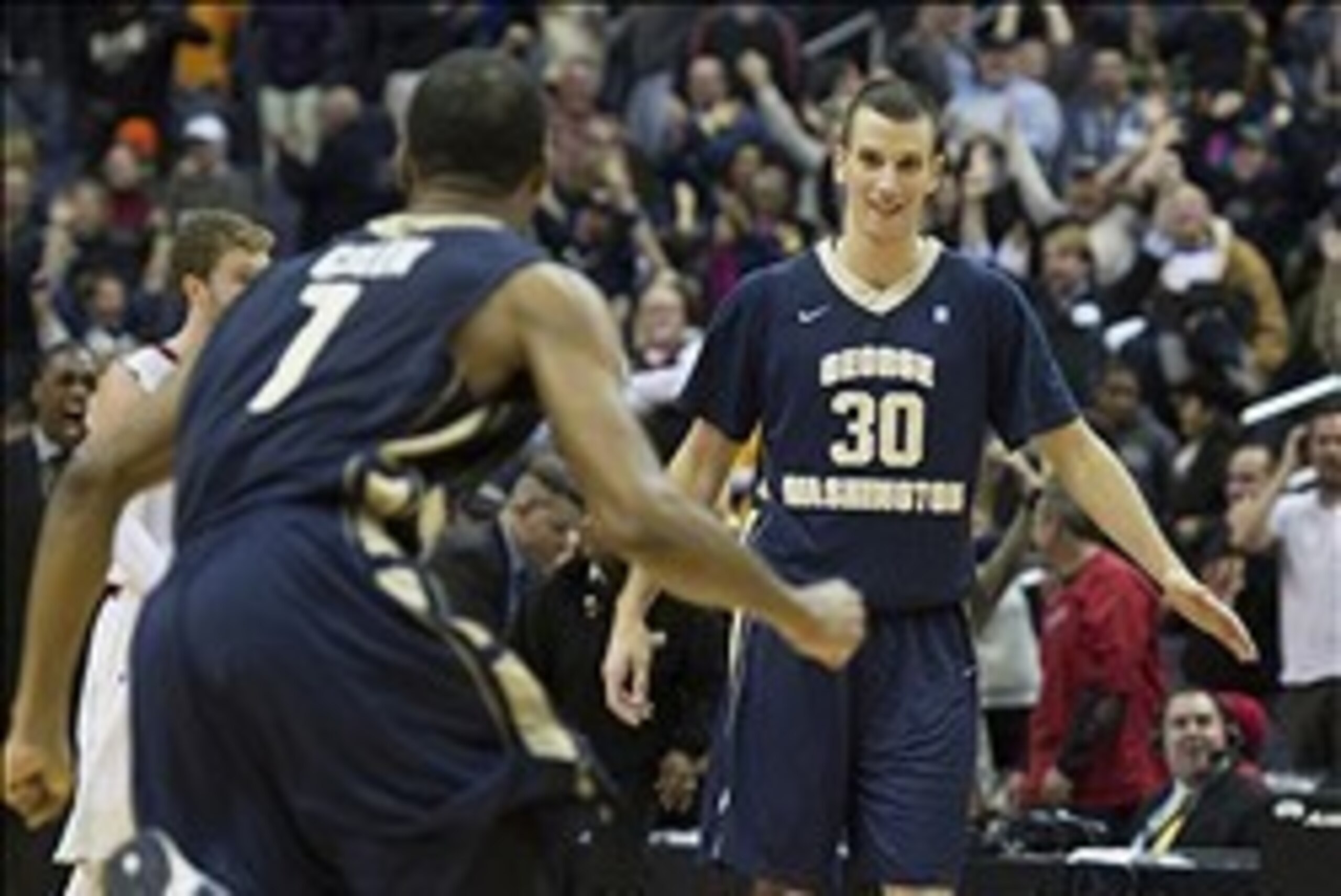 Dec 8, 2013; Washington, DC, USA; George Washington Colonials guard Maurice Creek (1) runs to George Washington Colonials forward Nemanja Mikic (30) after the game against Maryland Terrapins at Verizon Center. George Washington Colonials defeated Marylan Dec 8, 2013; Washington, DC, USA; George Washington Colonials guard Maurice Creek (1) runs to George Washington Colonials forward Nemanja Mikic (30) after the game against Maryland Terrapins at Verizon Center. George Washington Colonials defeated Marylan