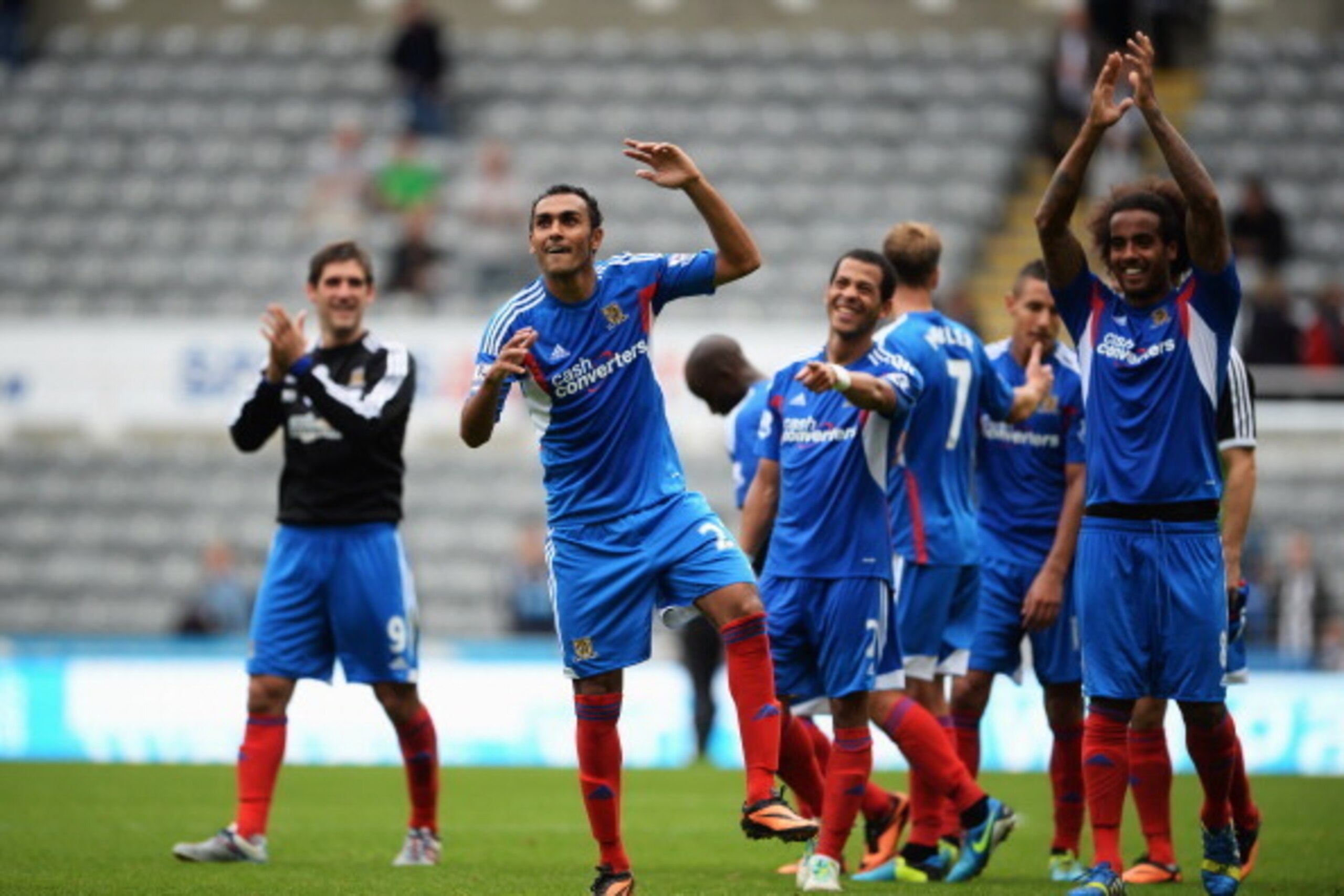 NEWCASTLE UPON TYNE, ENGLAND - SEPTEMBER 21: Hull City players celebrate victory following the Barclays Premier League match between Newcastle United and Hull City at St James' Park on September 21, 2013 in Newcastle upon Tyne, England.  (Photo by Michael