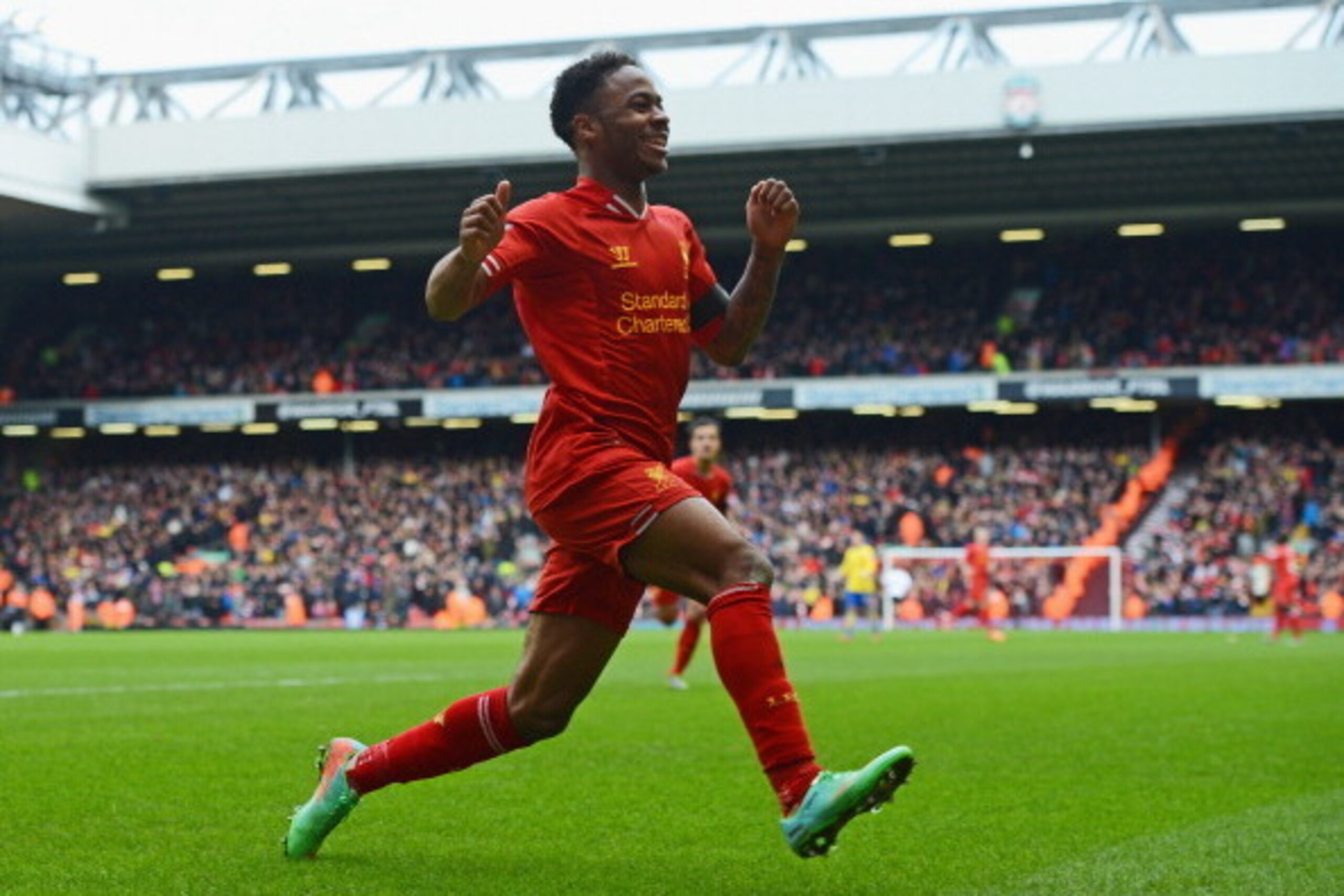 LIVERPOOL, ENGLAND - FEBRUARY 08:  Raheem Sterling of Liverpool celebrates scoring the fifth goal during the Barclays Premier League match between Liverpool and Arsenal at Anfield on February 8, 2014 in Liverpool, England.  (Photo by Michael Regan/Getty I