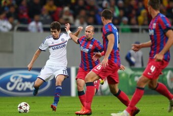 BUCHAREST, ROMANIA - OCTOBER 01: Oscar (L) of Chelsea is tracked by Iasmin Latovlevici (2L) of Steaua Bucurestiduring the UEFA Champions League Group E Match between FC Steaua Bucuresti and Chelsea at the National Arena Stadium on October 1, 2013 in Bucha