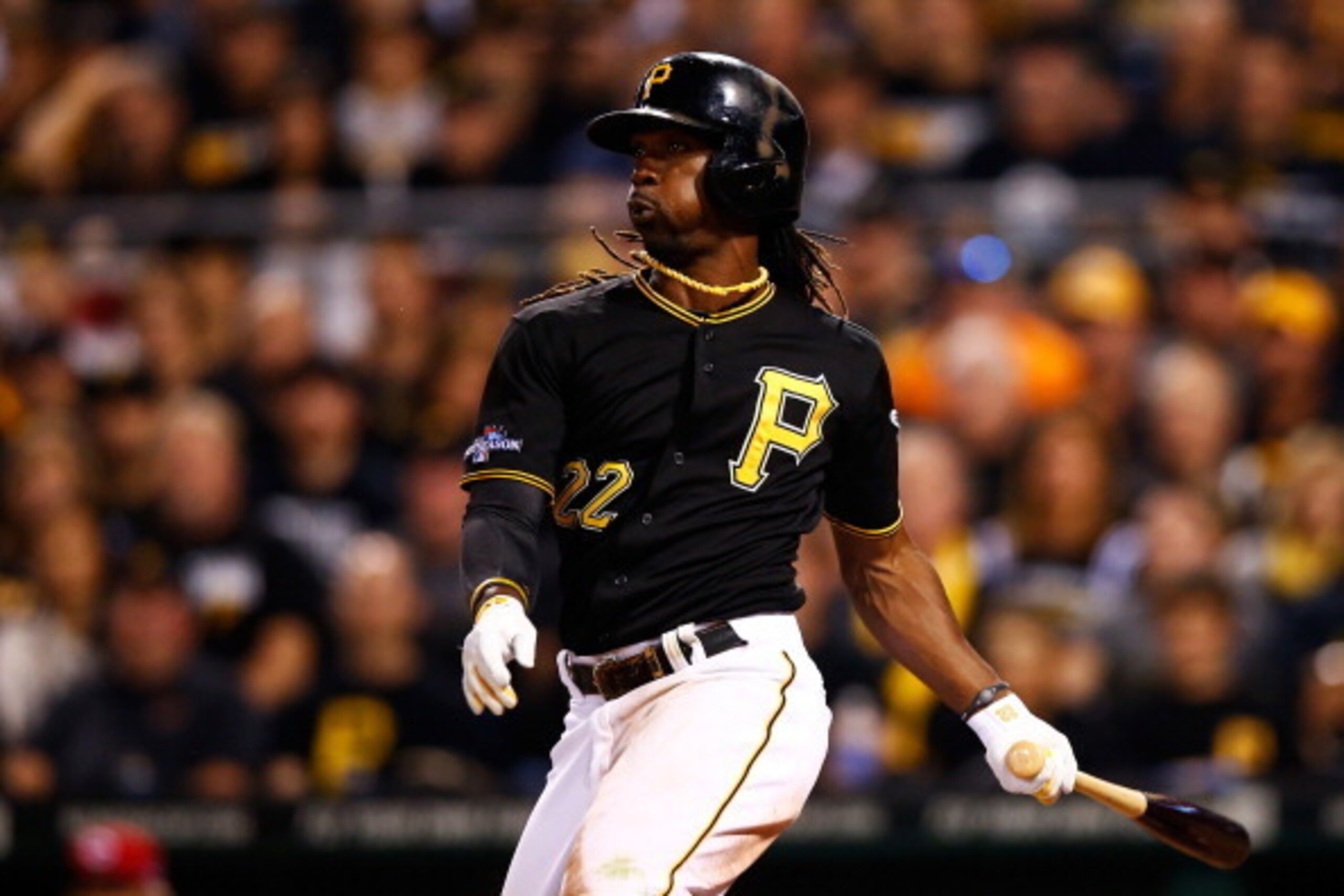 PITTSBURGH, PA - OCTOBER 01:  Andrew McCutchen #22 of the Pittsburgh Pirates hits a single in the sixth inning against the Cincinnati Reds during the National League Wild Card game at PNC Park on October 1, 2013 in Pittsburgh, Pennsylvania.  (Photo by Jar
