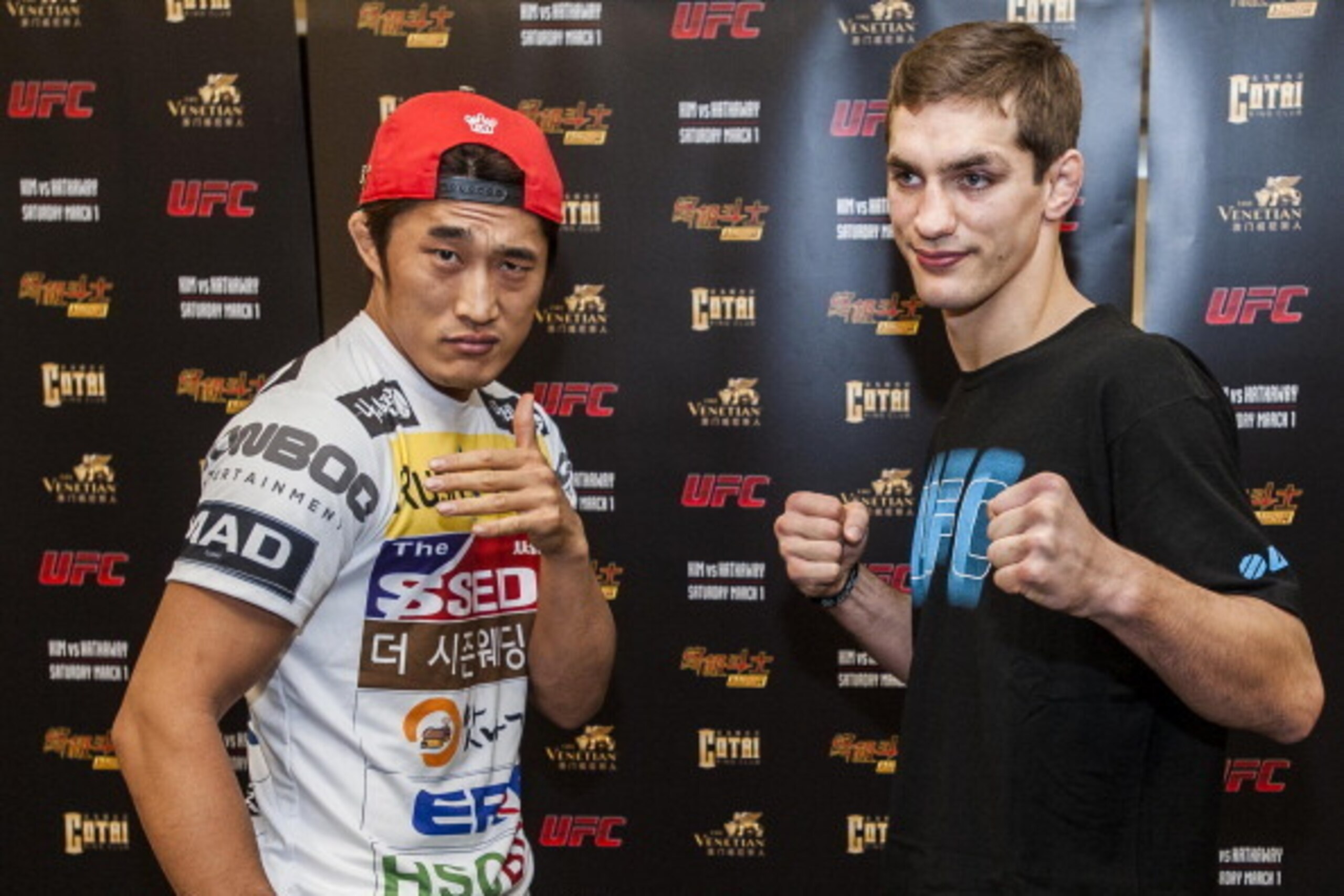 MACAU - FEBRUARY 26:  DH Kim (L) of South Korea and John Hathaway of England pose for media during the presentation of UFC Fight Night Macao Kim vs. Hathaway on February 26, 2014 in Macau  (Photo by Xaume Olleros/Getty Images)