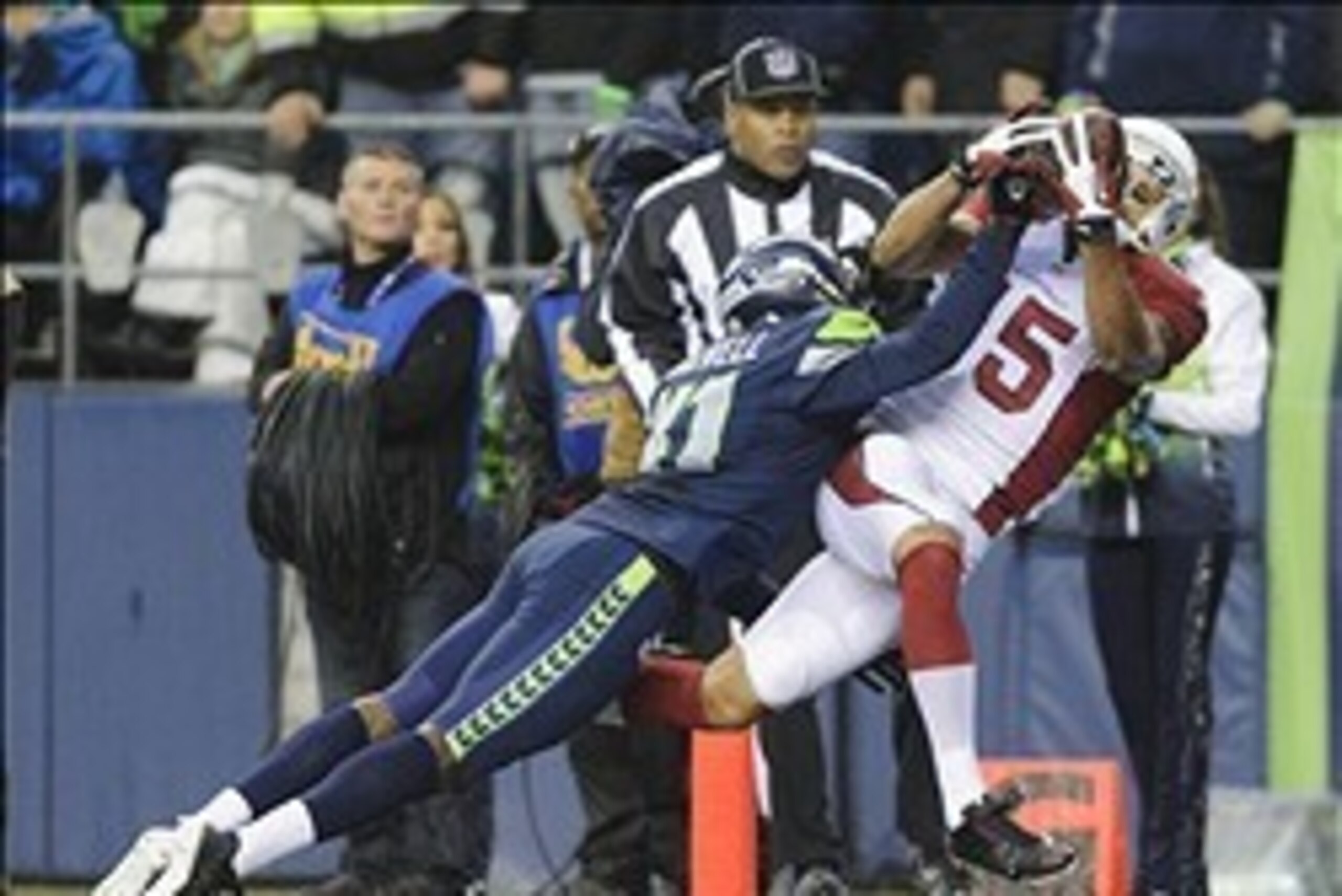 Dec 22, 2013; Seattle, WA, USA; Arizona Cardinals wide receiver Michael Floyd (15) catches a pass for a touchdown over Seattle Seahawks cornerback Byron Maxwell (41) during the second half at CenturyLink Field. Arizona defeated Seattle 17-10. Mandatory Cr