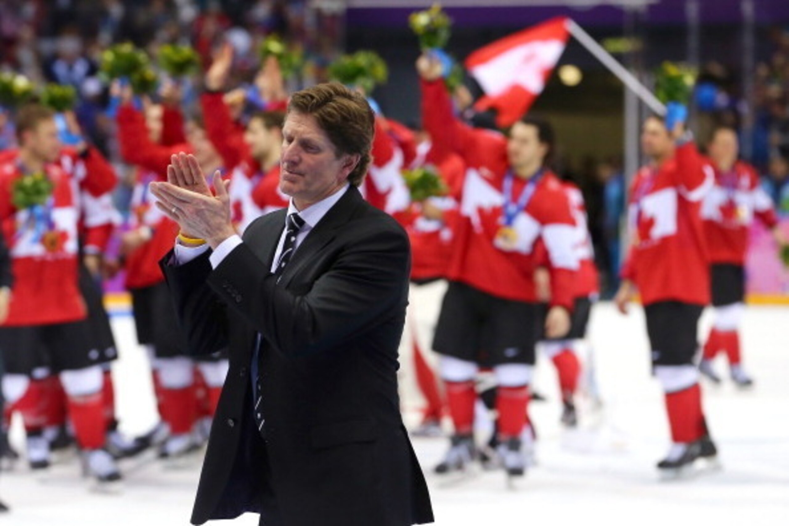SOCHI, RUSSIA - FEBRUARY 23: Head coach Mike Babcock of Canada applauds his team following their 3-0 victory during the Men's Ice Hockey Gold Medal match on Day 16 of the 2014 Sochi Winter Olympics at Bolshoy Ice Dome on February 23, 2014 in Sochi, Russi SOCHI, RUSSIA - FEBRUARY 23: Head coach Mike Babcock of Canada applauds his team following their 3-0 victory during the Men's Ice Hockey Gold Medal match on Day 16 of the 2014 Sochi Winter Olympics at Bolshoy Ice Dome on February 23, 2014 in Sochi, Russi