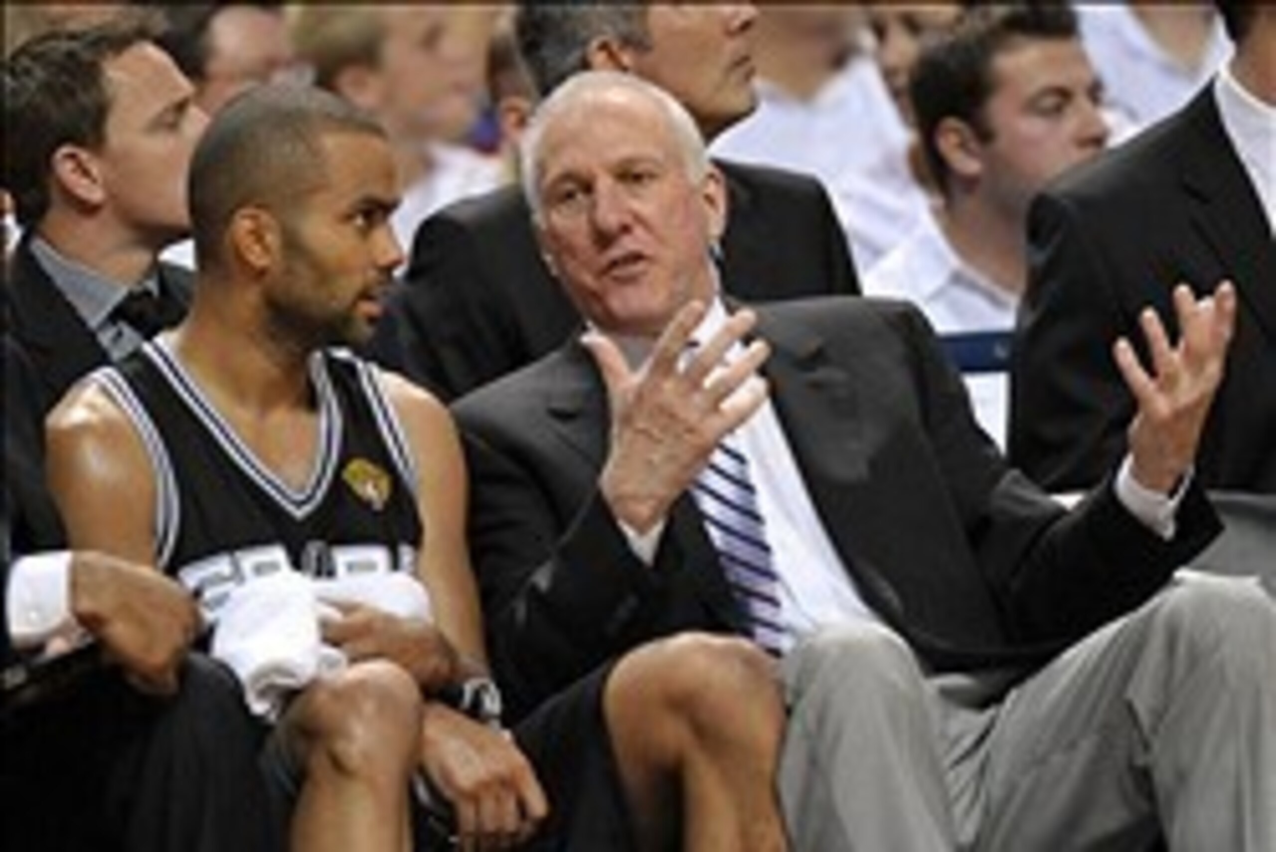 Jun 20, 2013; Miami, FL, USA; San Antonio Spurs head coach Gregg Popovich talks with point guard Tony Parker (right) on the bench during the third quarter of game seven in the 2013 NBA Finals against the Miami Heat at American Airlines Arena. Mandatory Cr