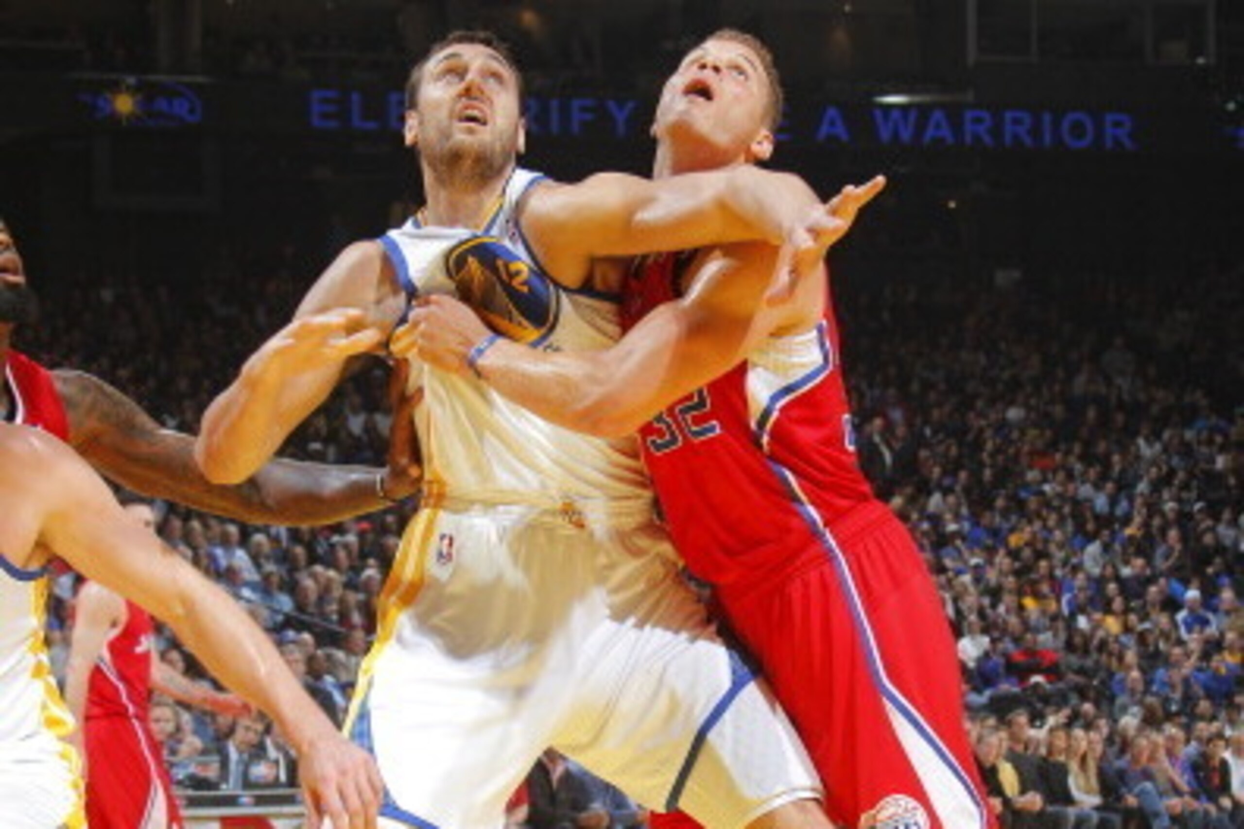 OAKLAND, CA - JANUARY 30: Andrew Bogut #12 of the Golden State Warriors wrestles for position against Blake Griffin #32 of the Los Angeles Clippers on January 30, 2014 at Oracle Arena in Oakland, California. NOTE TO USER: User expressly acknowledges and a