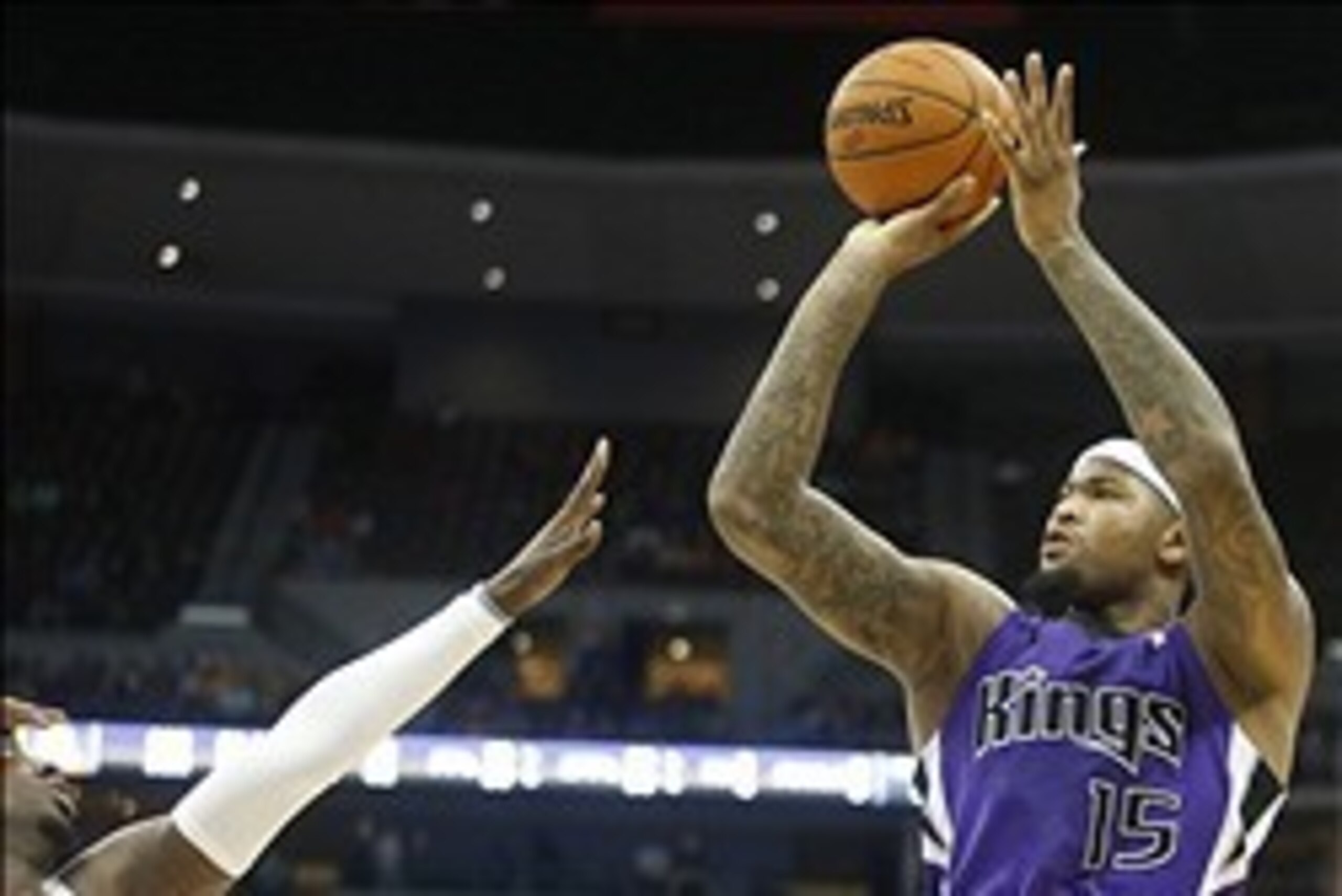 Feb 23, 2014; Denver, CO, USA; Sacramento Kings center DeMarcus Cousins (15) shoots the ball during the second half against the Denver Nuggets at Pepsi Center.  The Kings won 109-95. Mandatory Credit: Chris Humphreys-USA TODAY Sports